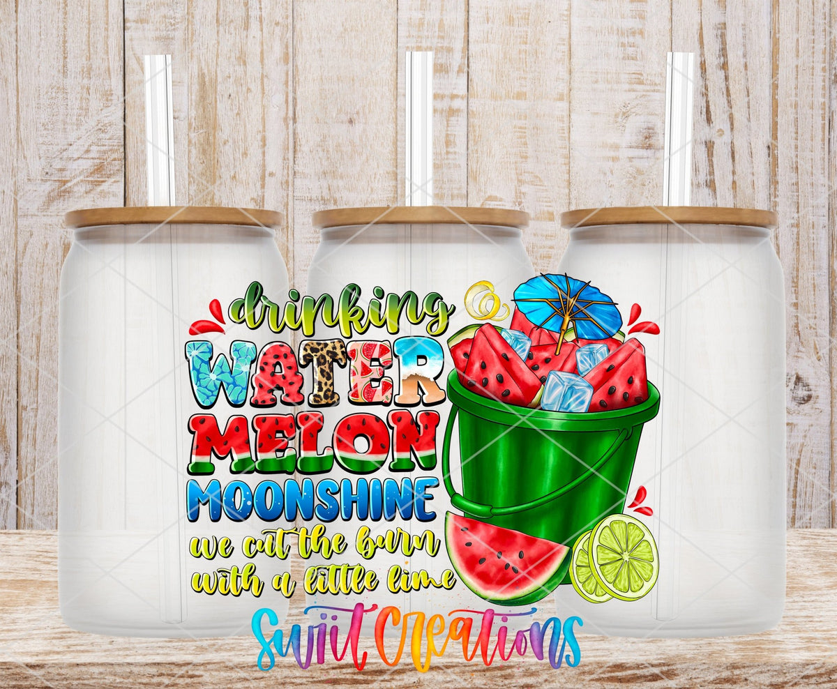 Drinking Watermelon Moonshine UV DTF transfer applied to a clear glass can set from Swiit Creations