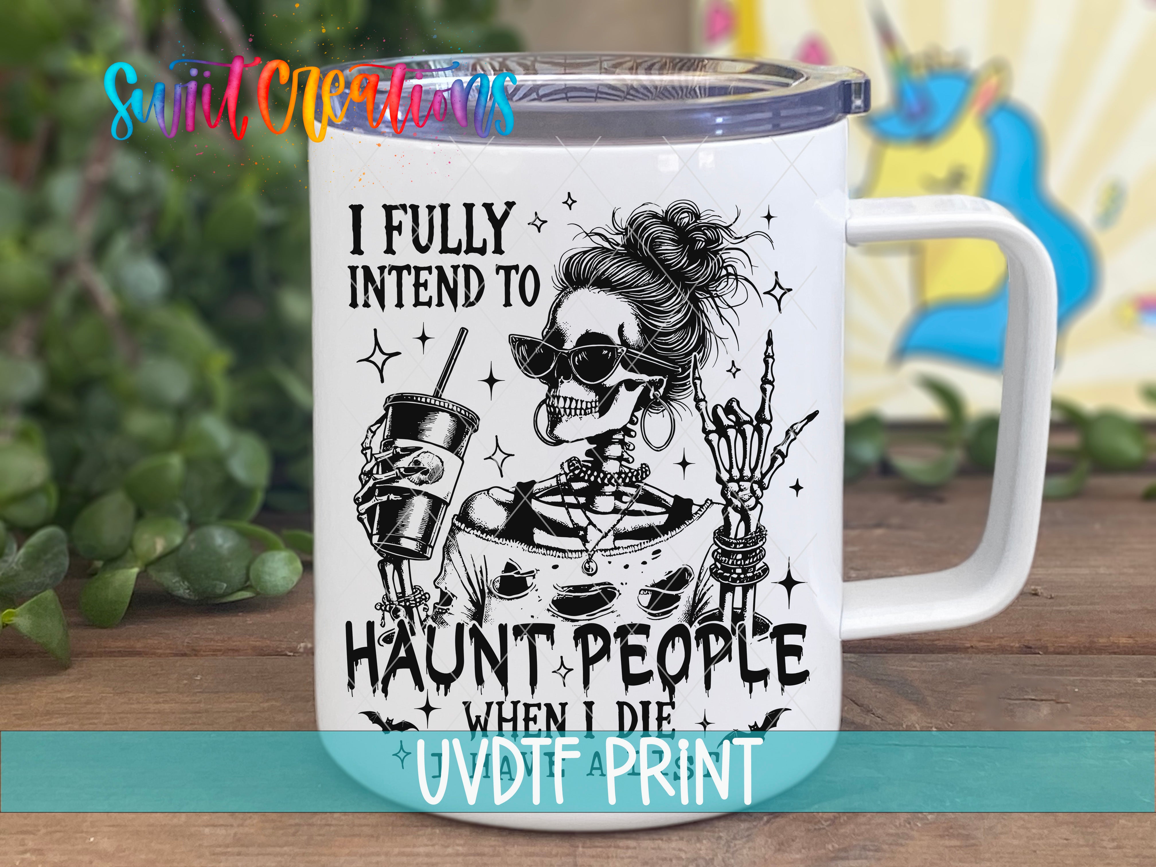 A white mug with a black and white illustration of a skeleton wearing sunglasses and holding a drink, along with the text "I FULLY INTEND TO HAUNT PEOPLE WHEN I DIE" printed on it.