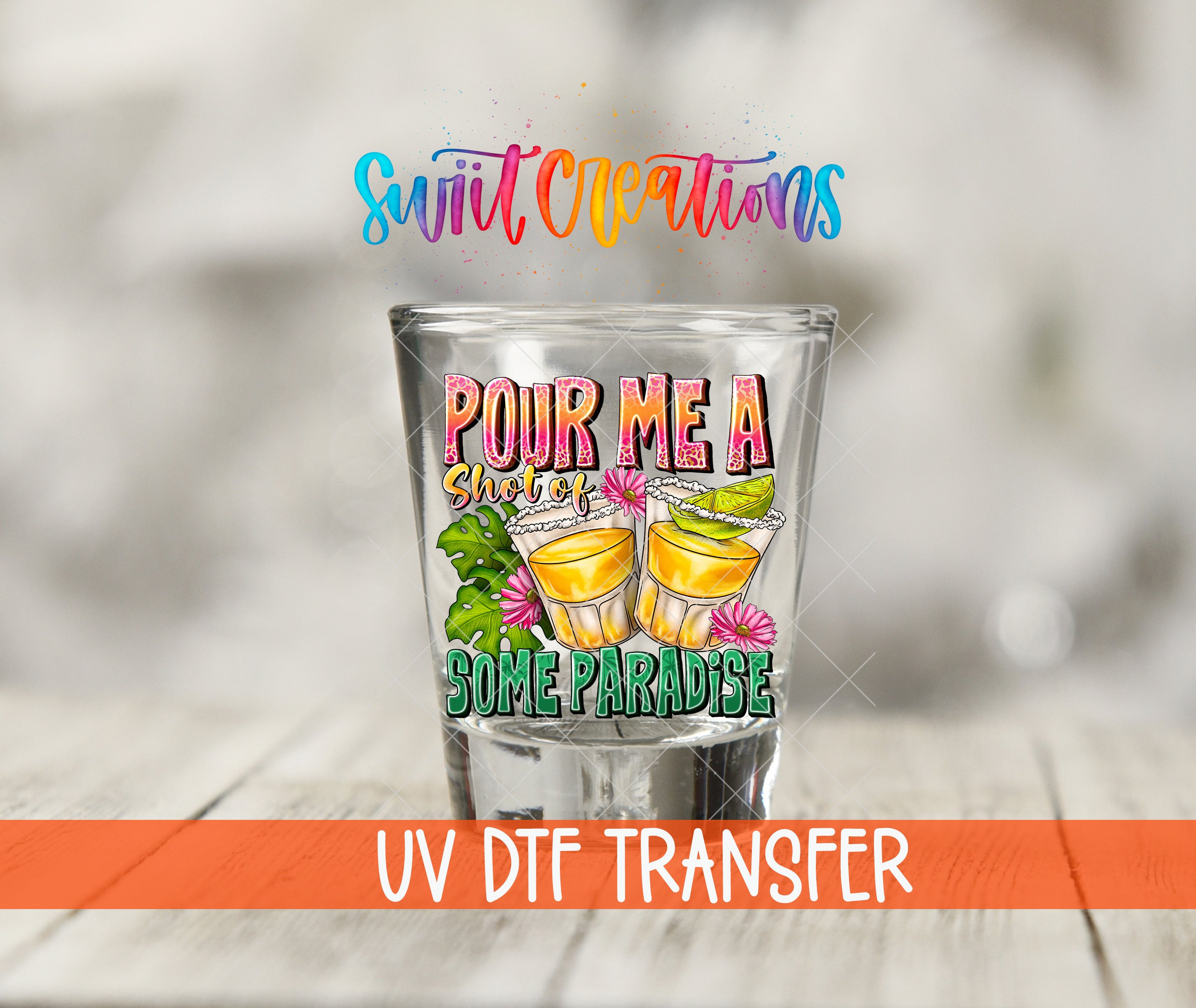 a shot glass with a colorful design and text, including the phrase "POUR ME A SHOT OF SOME PARADISE".