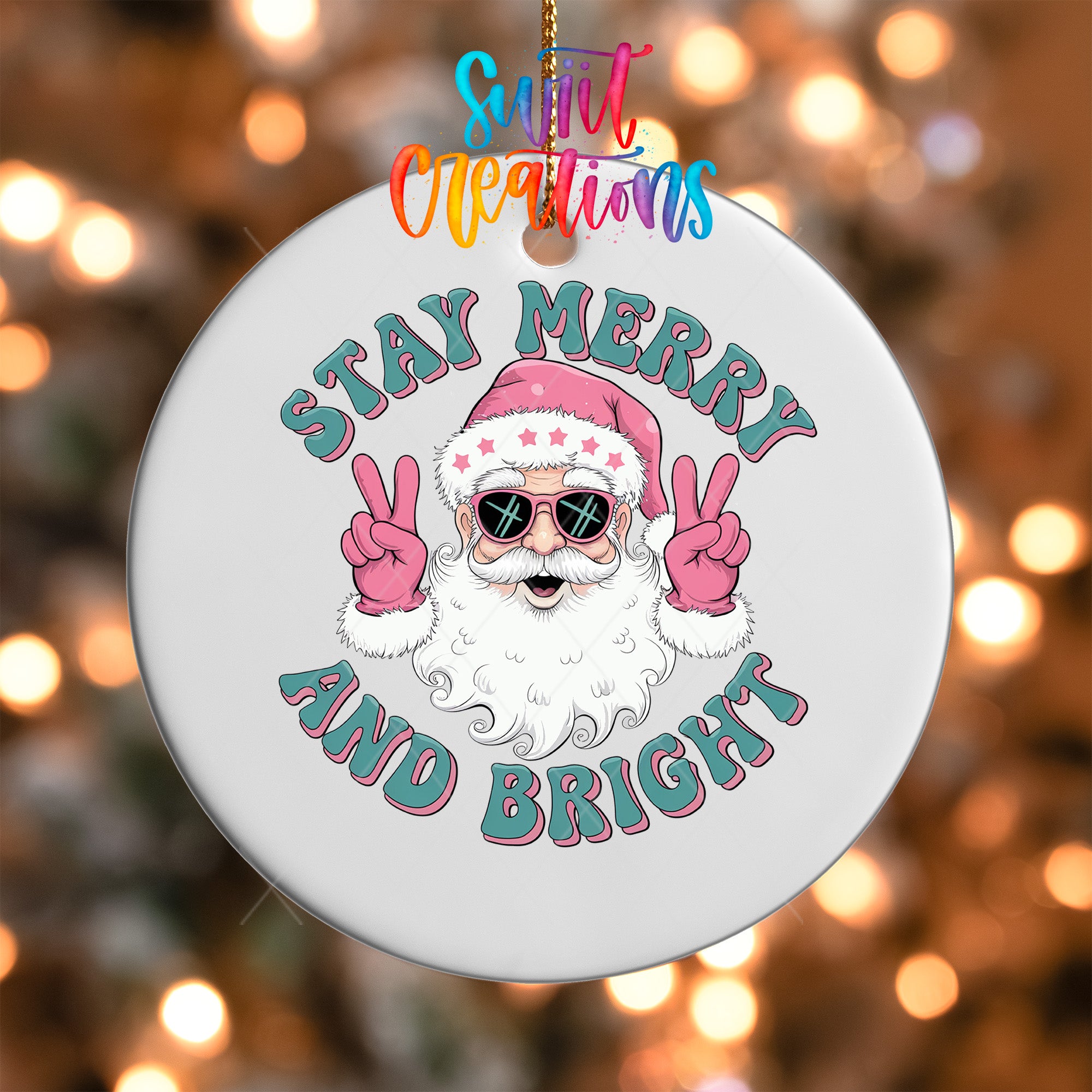 A white ornament with a Santa Claus face and sunglasses, along with the text "Stay Merry and Bright" in a colorful, retro-style font.