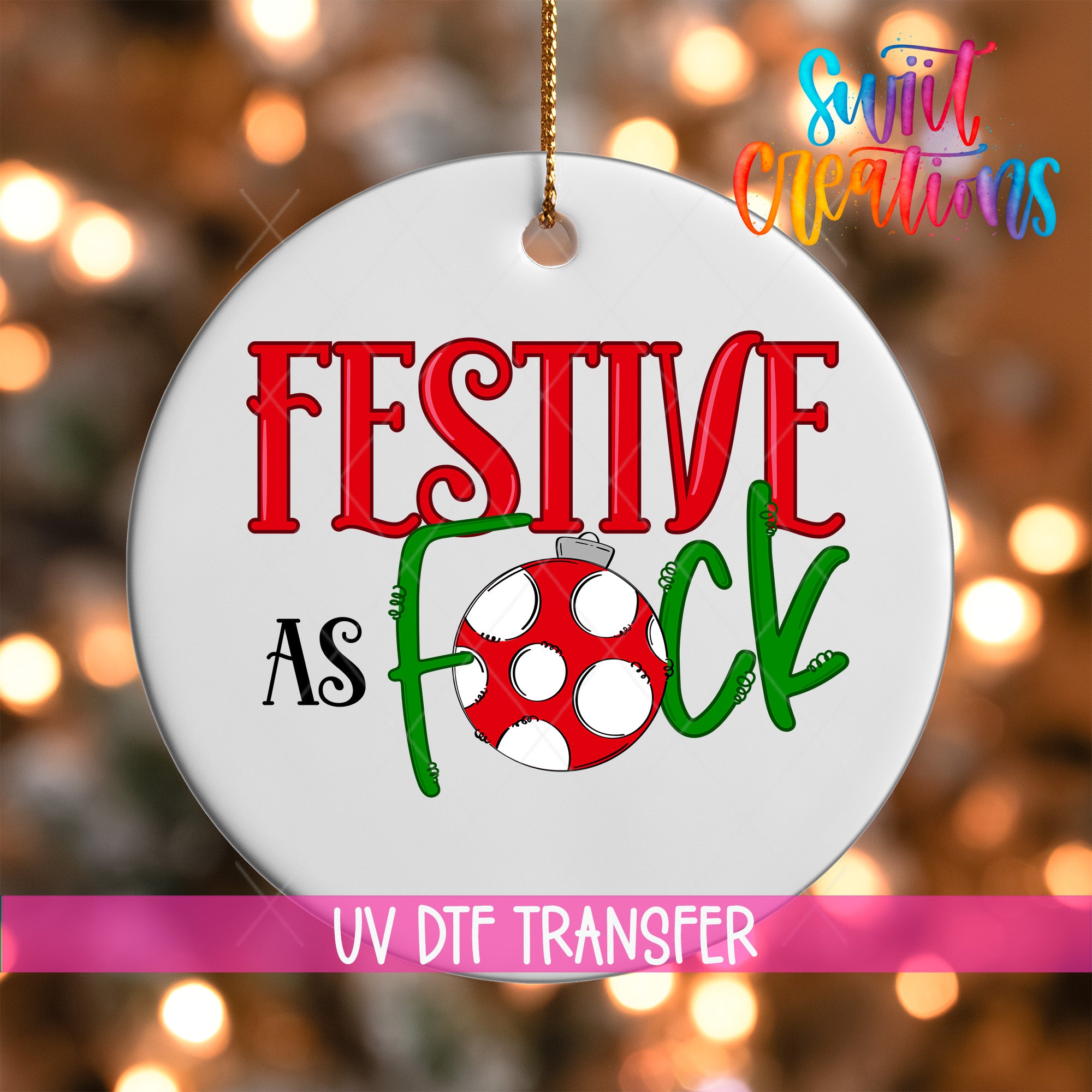 A white ornament with the text "FESTIVE AS FOCK" and a red and green polka dot design, hanging against a background of colorful lights.