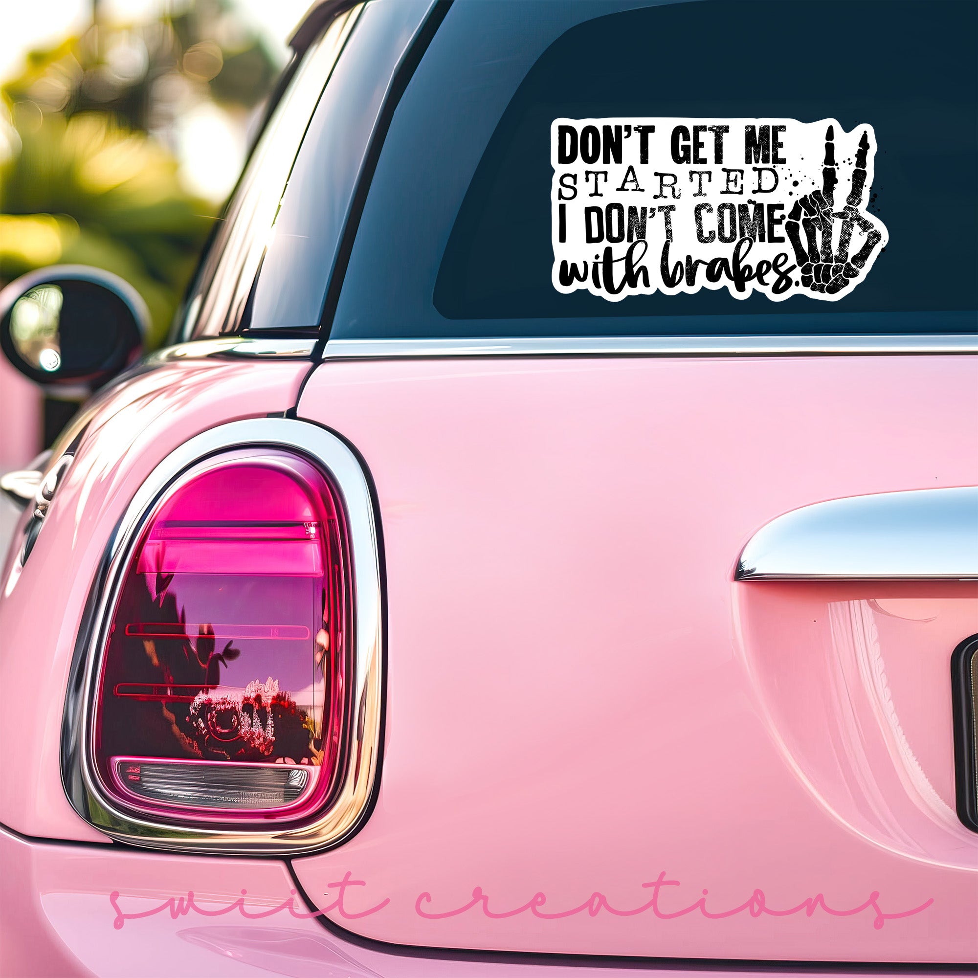 a pink car with a sticker that says don't get me started,