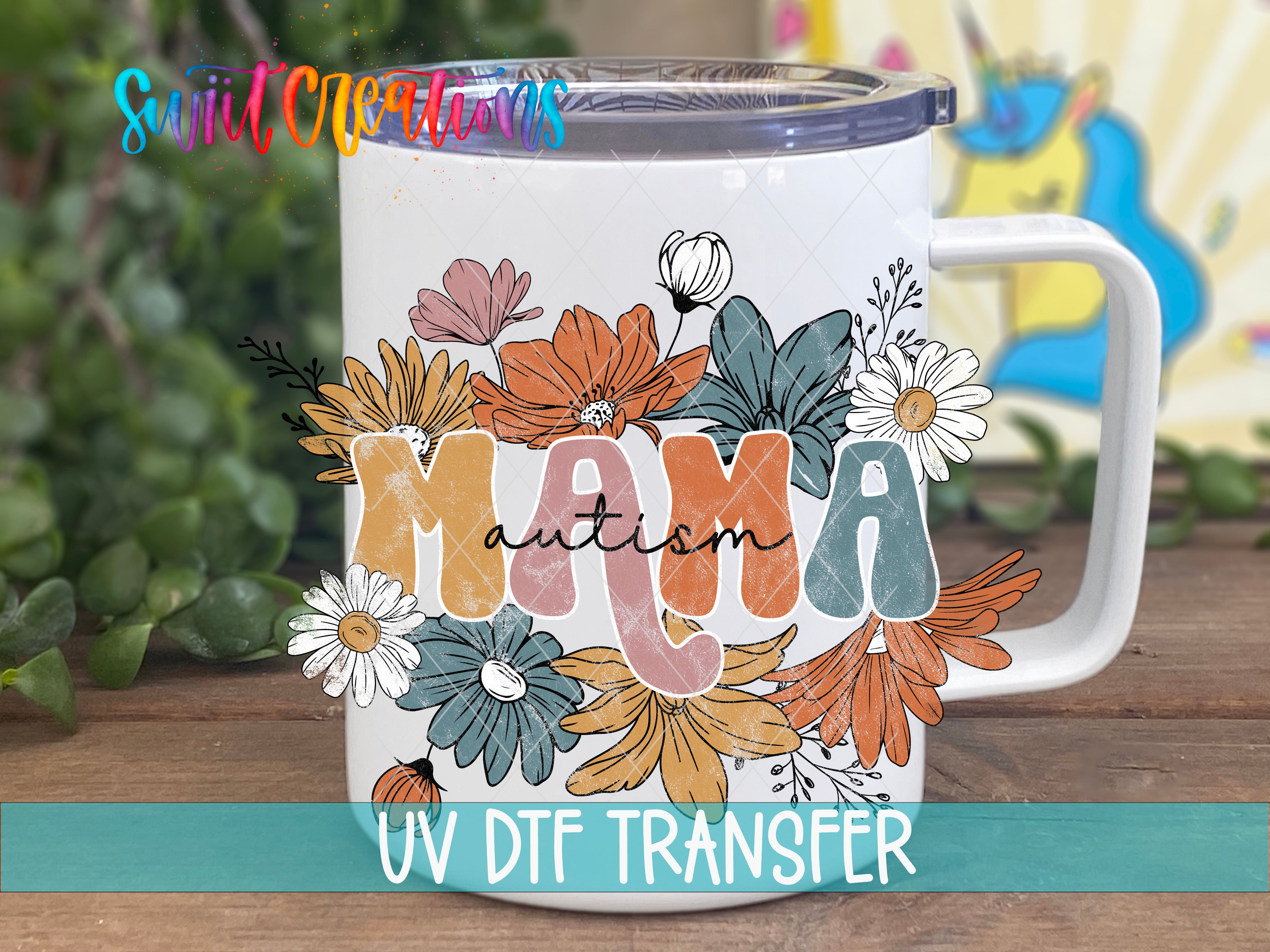 A white ceramic mug with a colorful floral design and the word "Autism" printed on it.