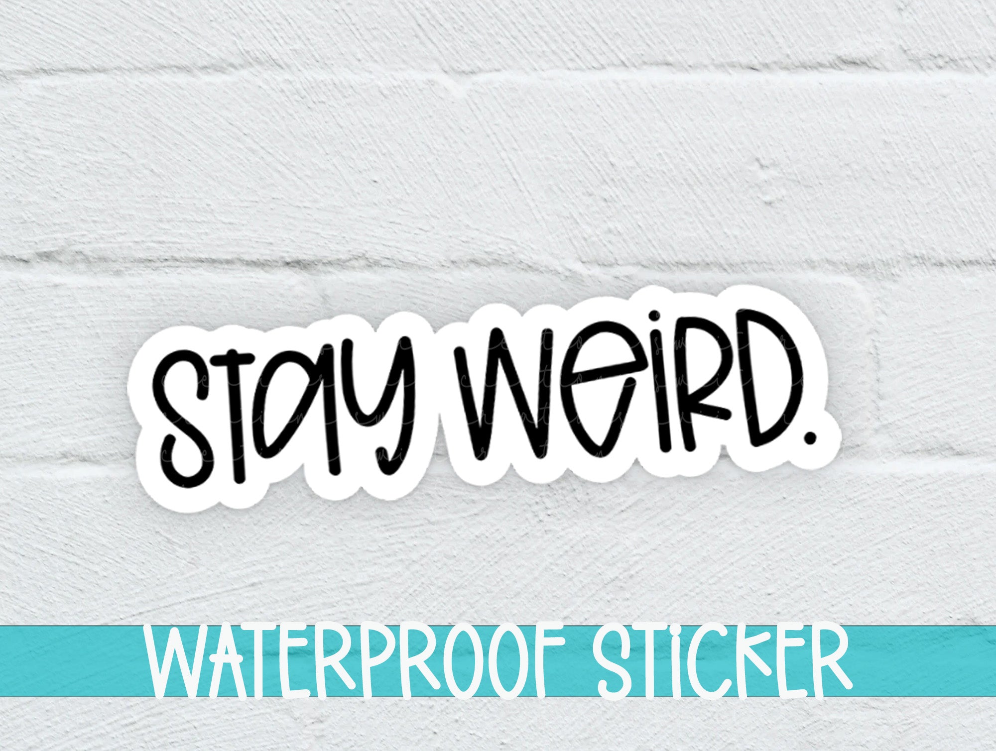 a sticker that says stay weird on a white brick wall