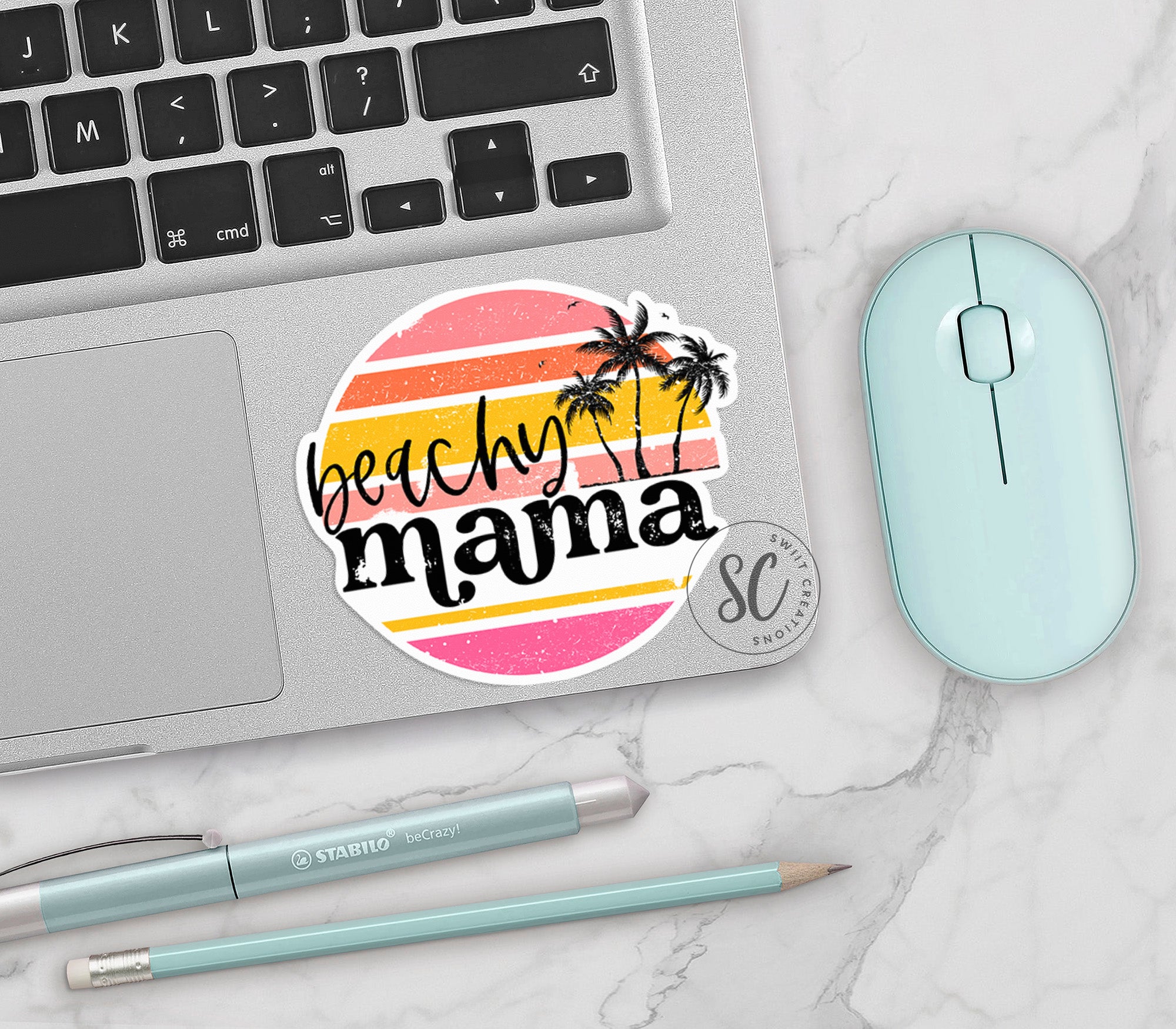 a laptop with a sticker that says beach mama