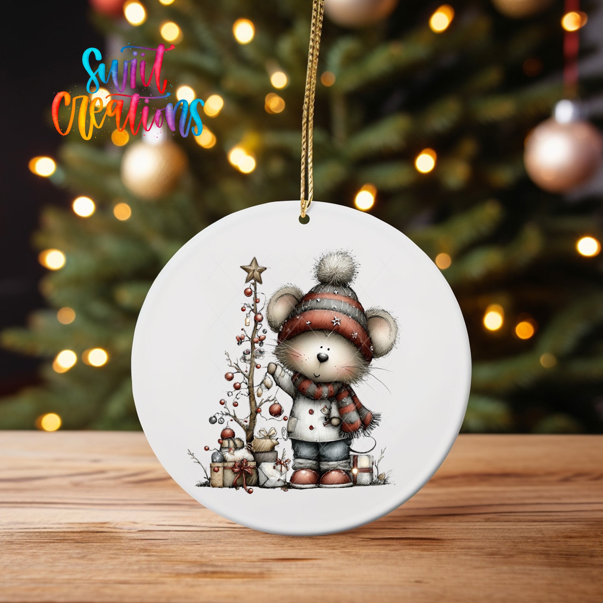 A white ceramic ornament featuring a cartoon mouse standing next to a Christmas tree, with ornaments and a star on the tree.