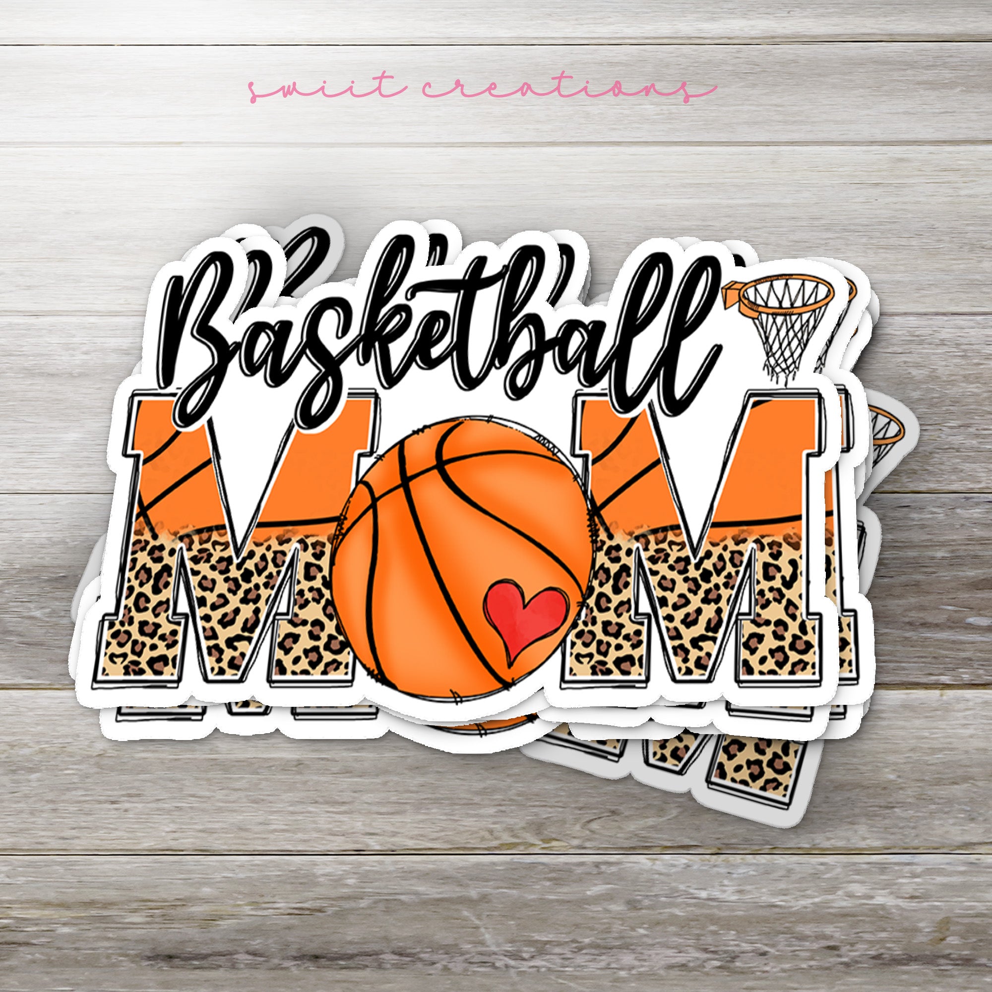 a basketball mom sticker on a wooden surface