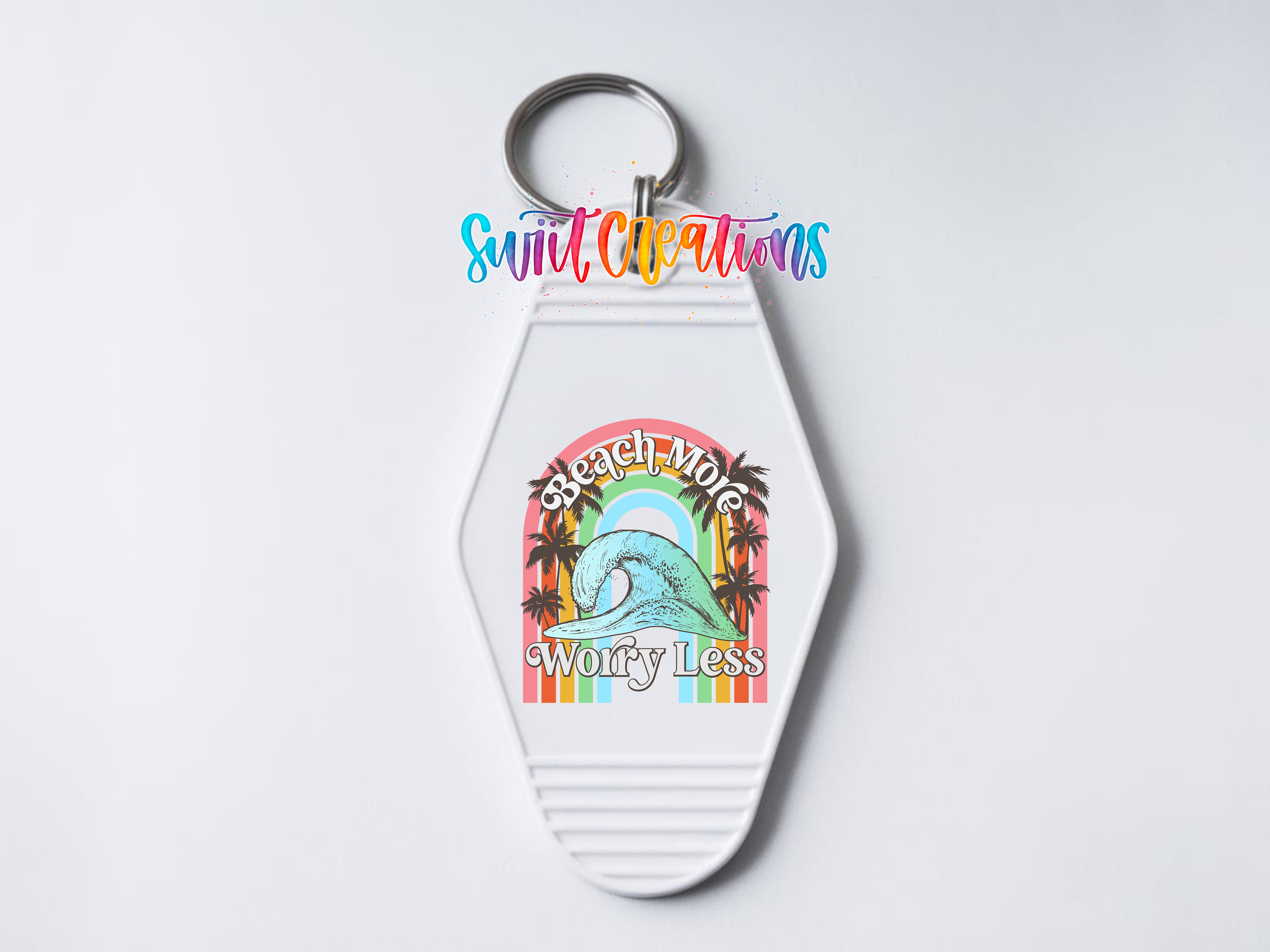A keychain with a colorful graphic design and text on it.