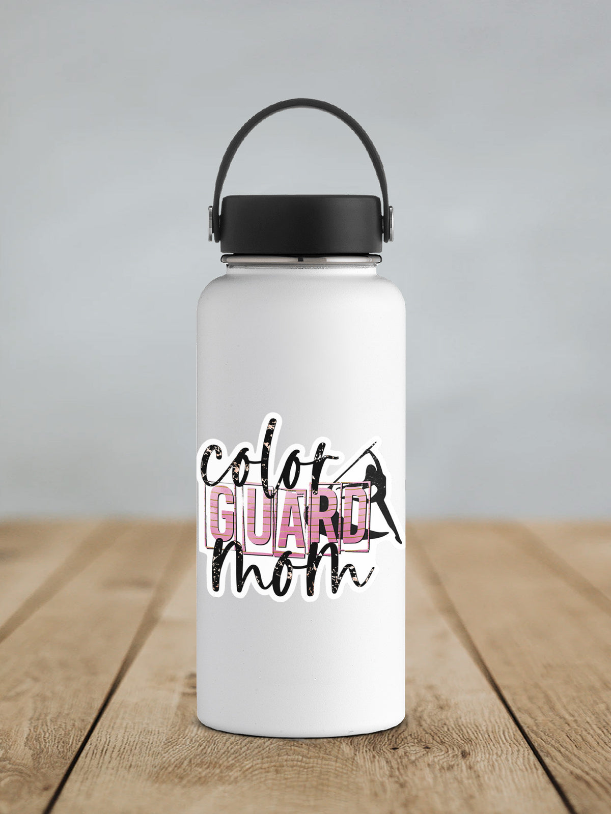a white water bottle sitting on top of a wooden table