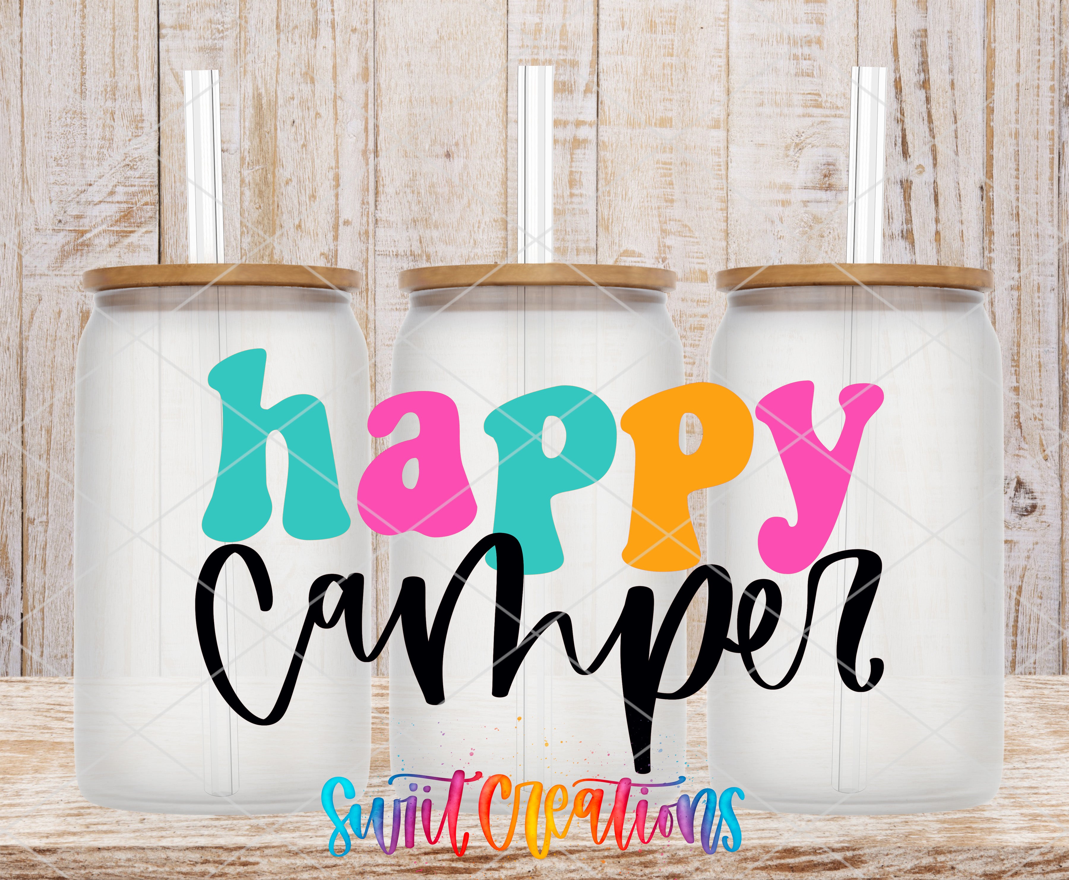 three colorful glass jars with straws, each containing a drink, and the text "Happy Camper" written on them.
