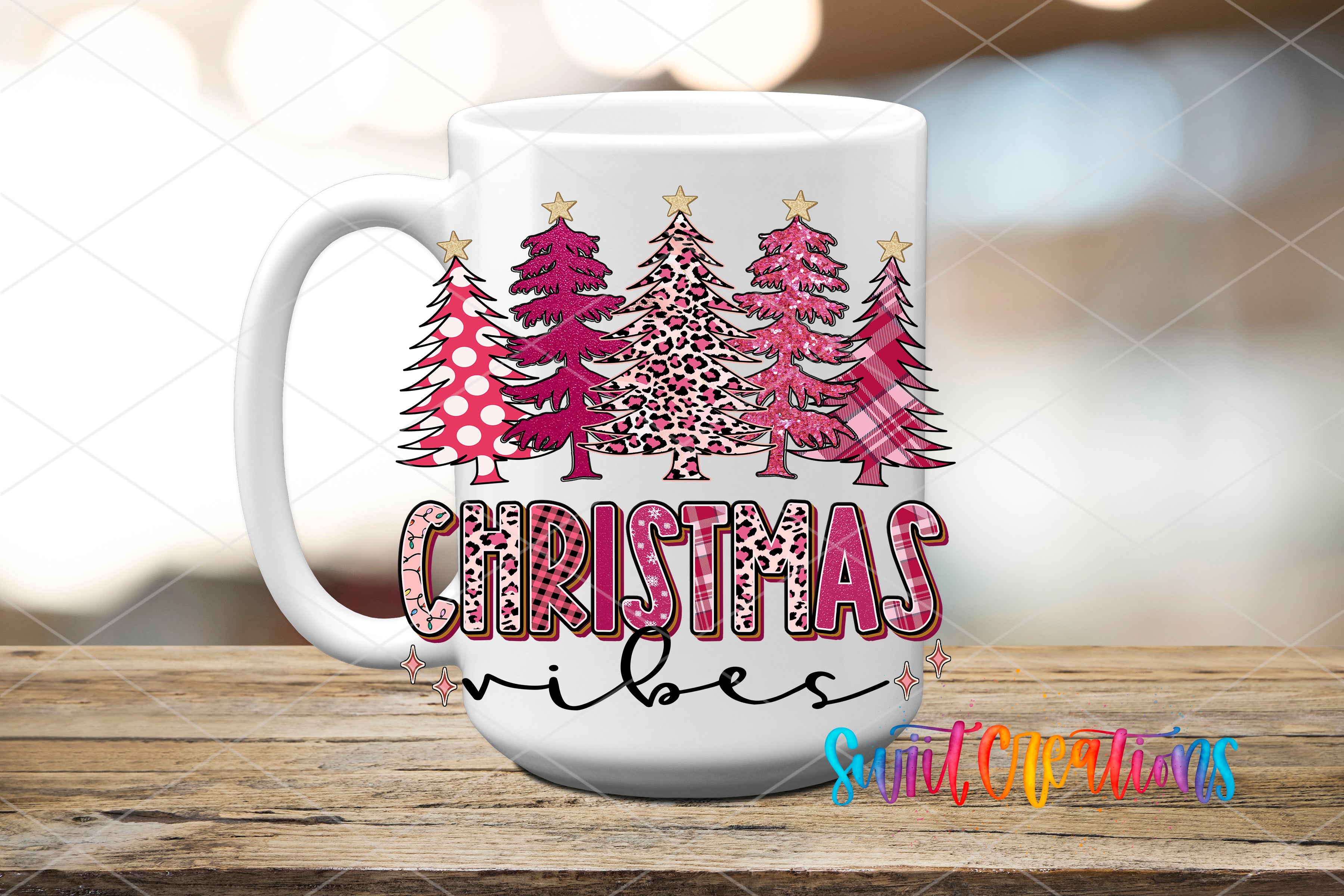 A white mug with a Christmas tree design and the text "Christmas vibes" printed on it.