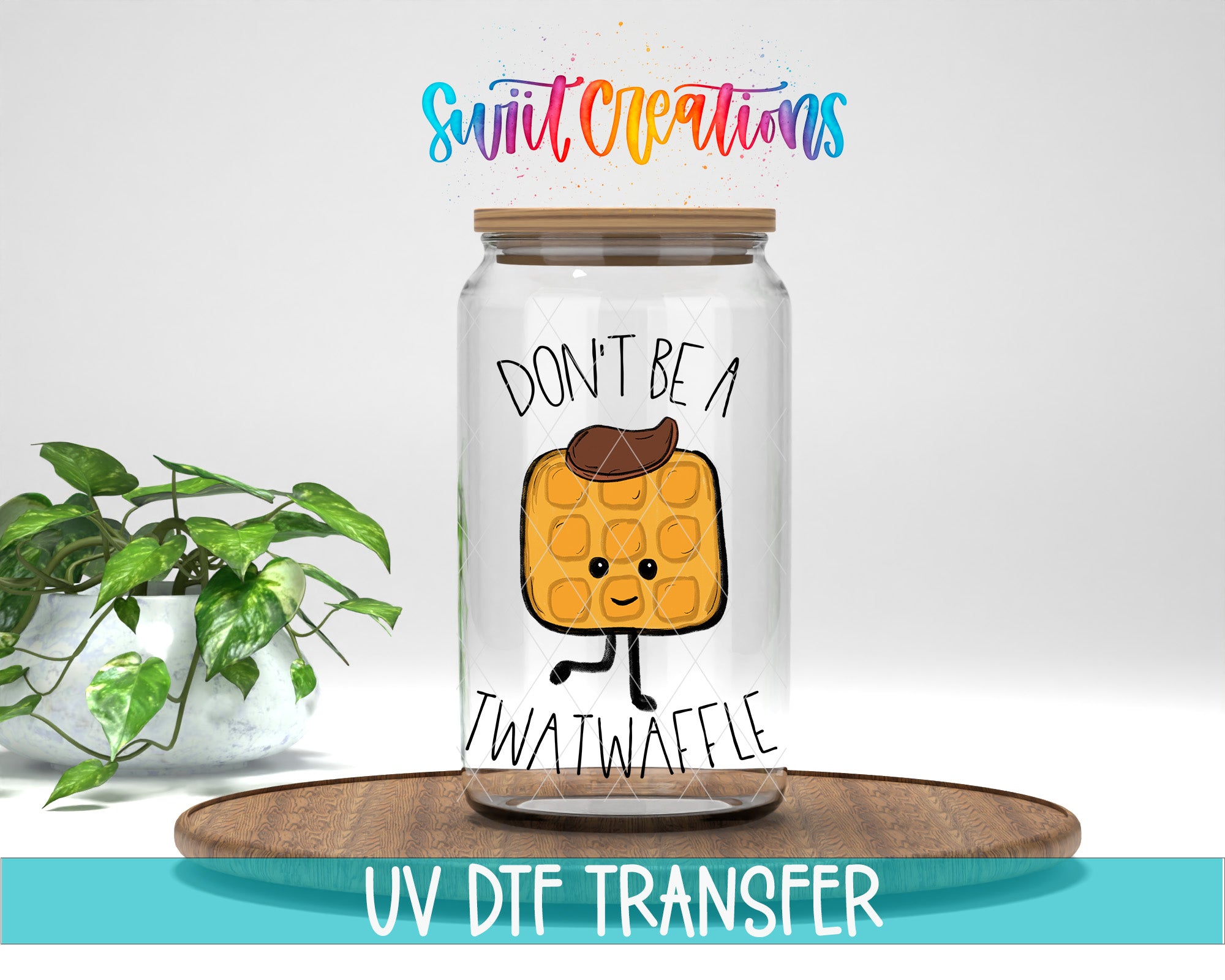 a glass jar with a cartoon waffle on it, placed on a wooden surface. The jar has a lid and a label that says "DON'T BE A TWATWAFLEE". There is also text at the bottom of the image that says "UV DFT TRANSFER".