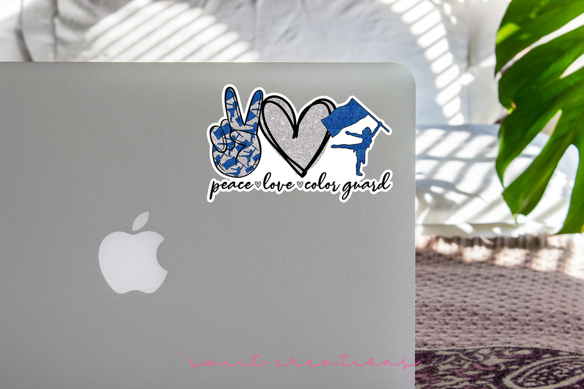 a laptop computer sitting on top of a table