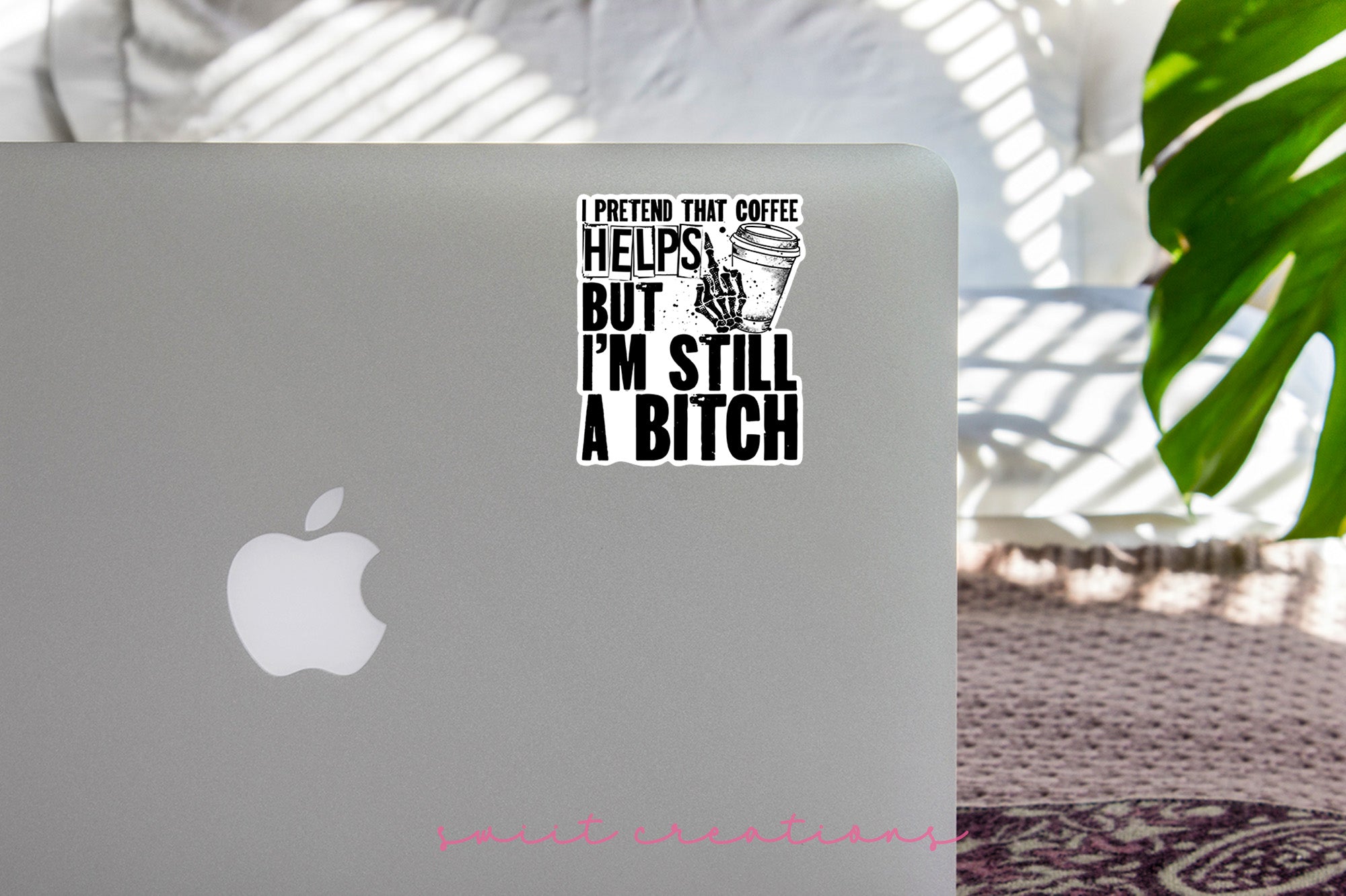 a laptop with a sticker on it sitting on a table