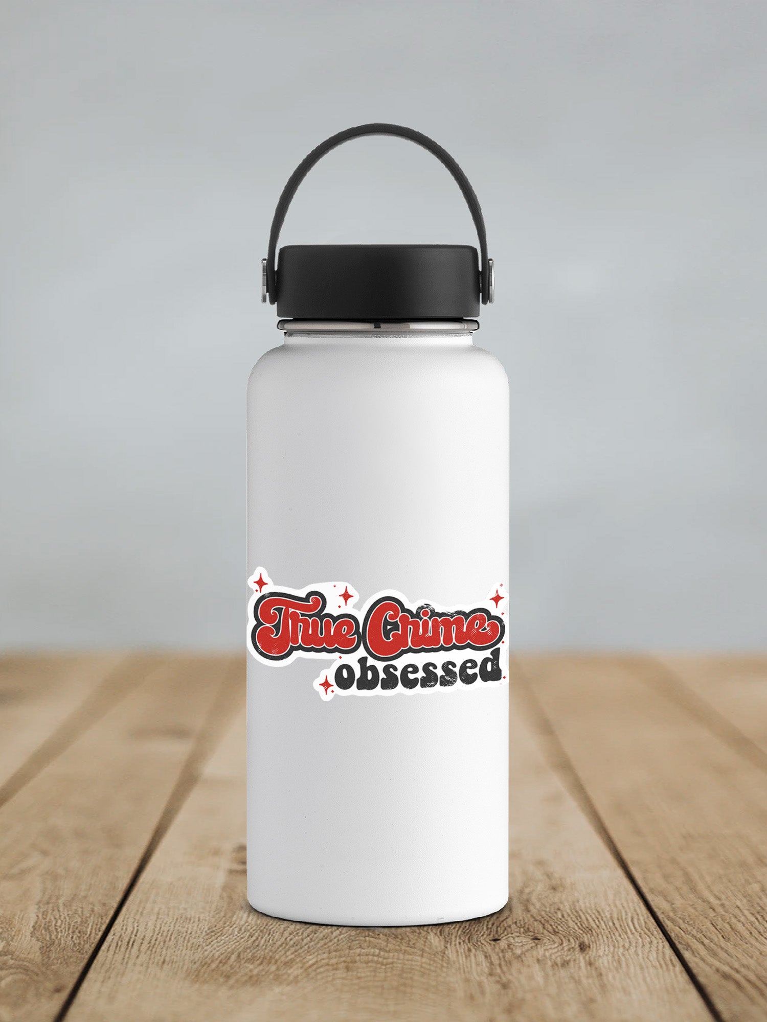 a white water bottle sitting on top of a wooden table