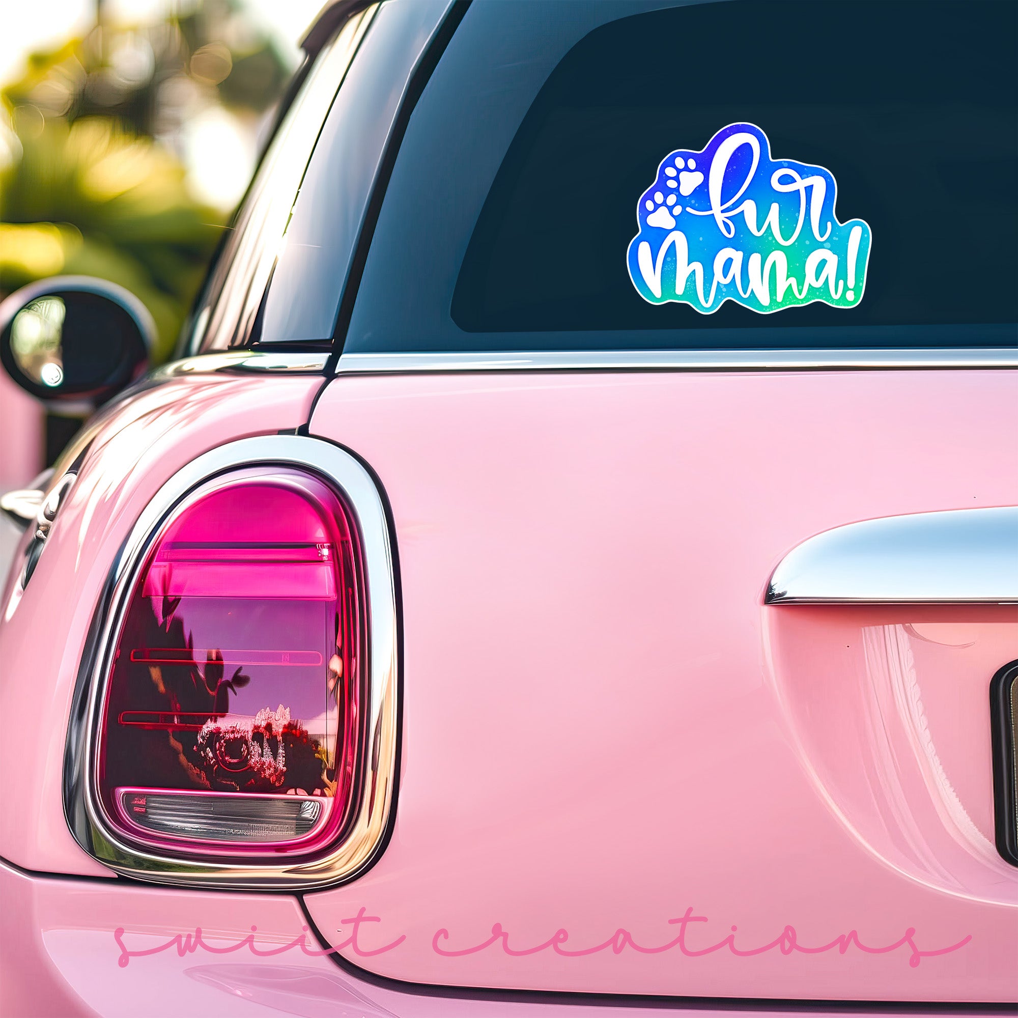 a pink car that has a sticker on it
