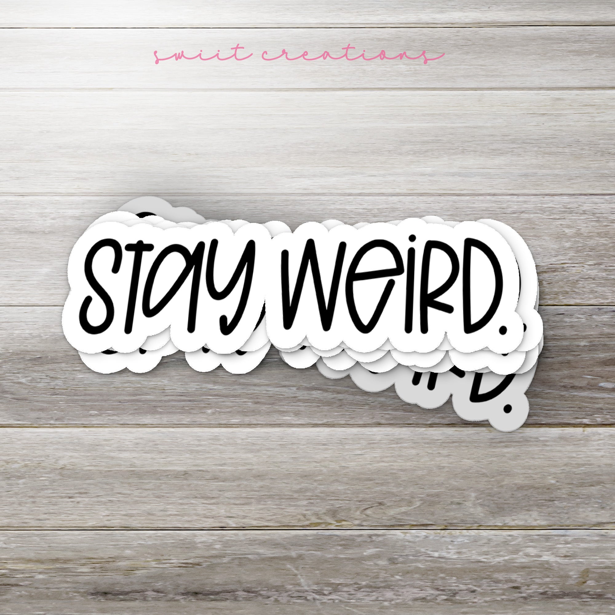 a sticker that says stay weird on it