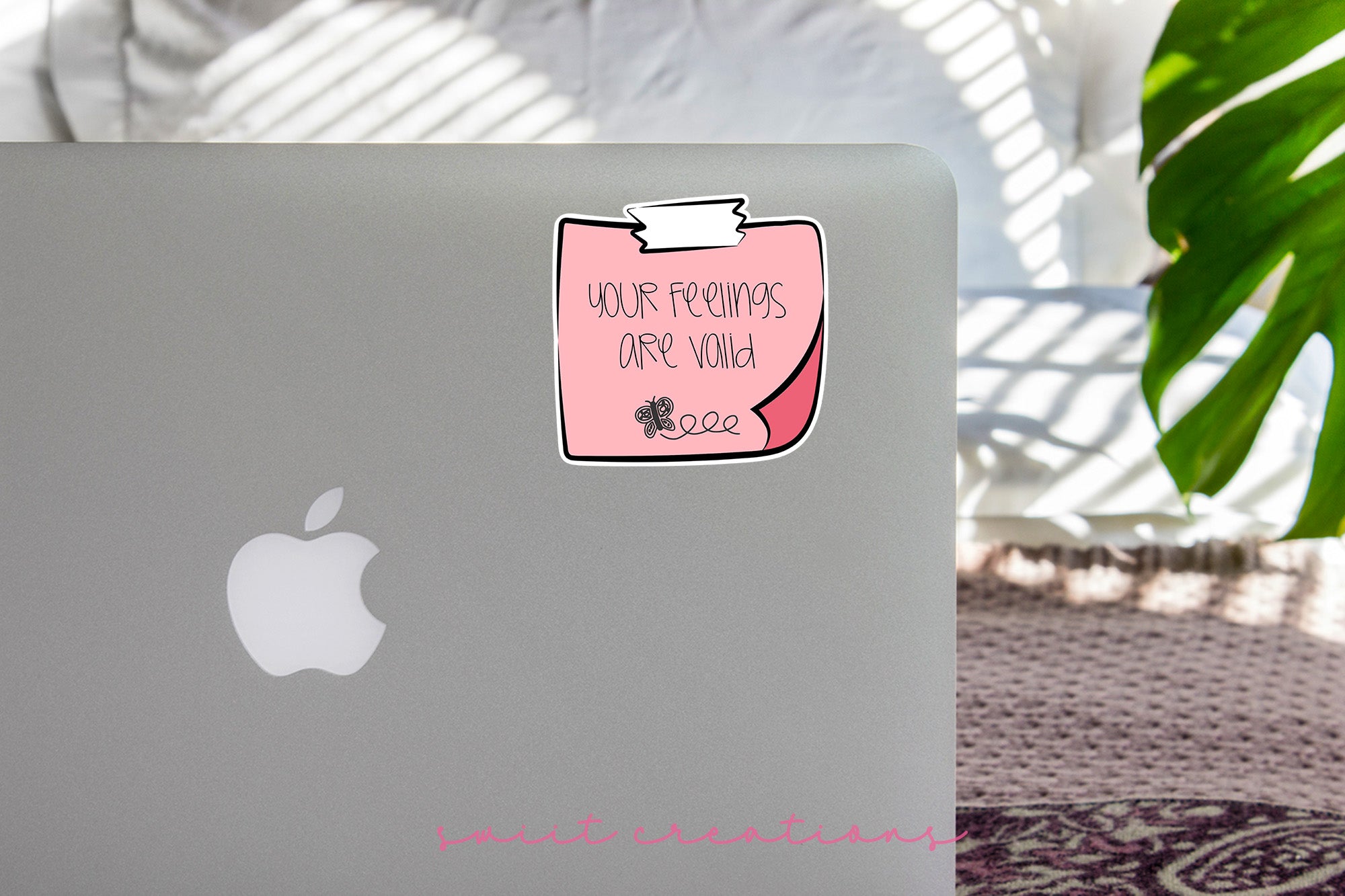 a laptop with a sticker on it sitting on a table