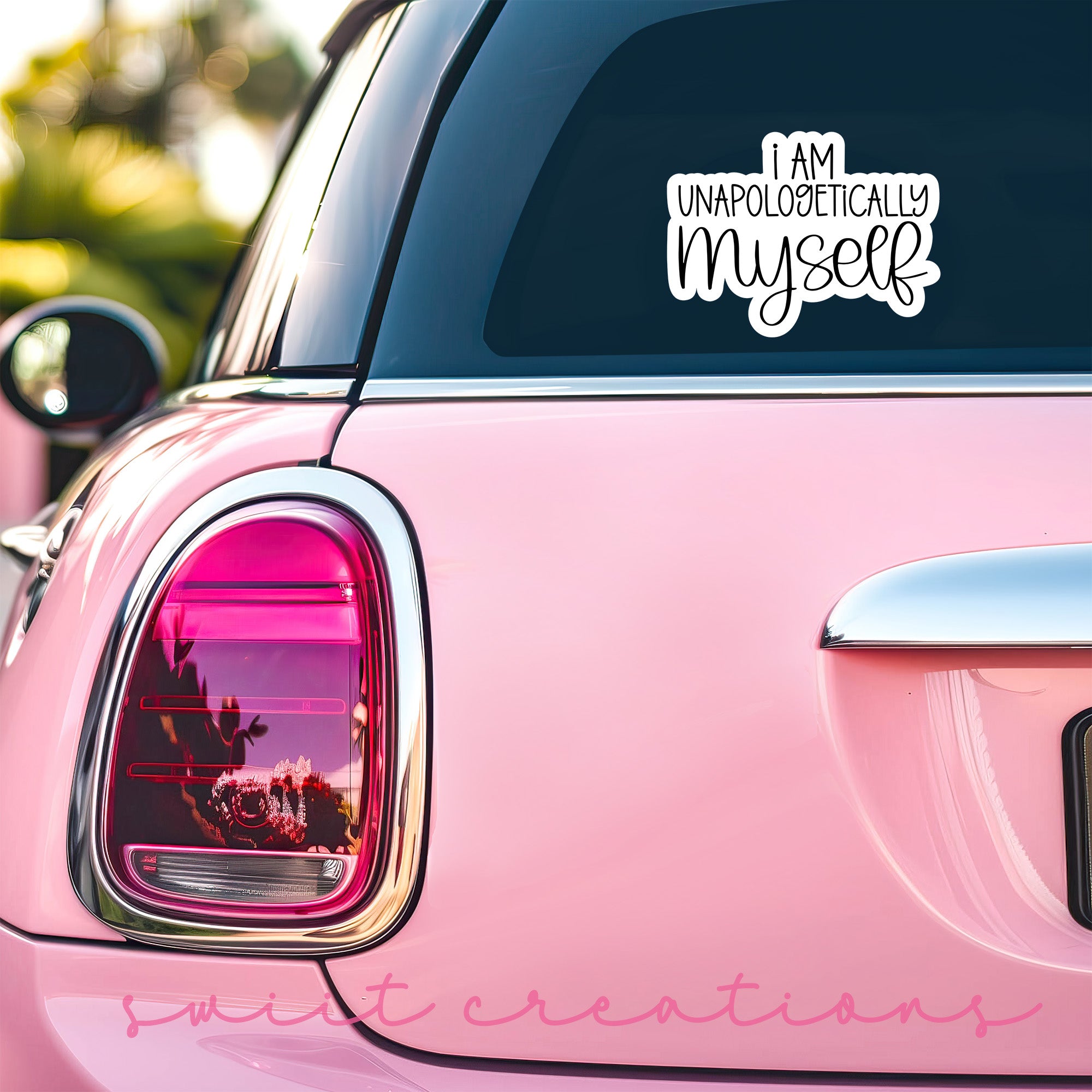 a pink car that has a sticker on it