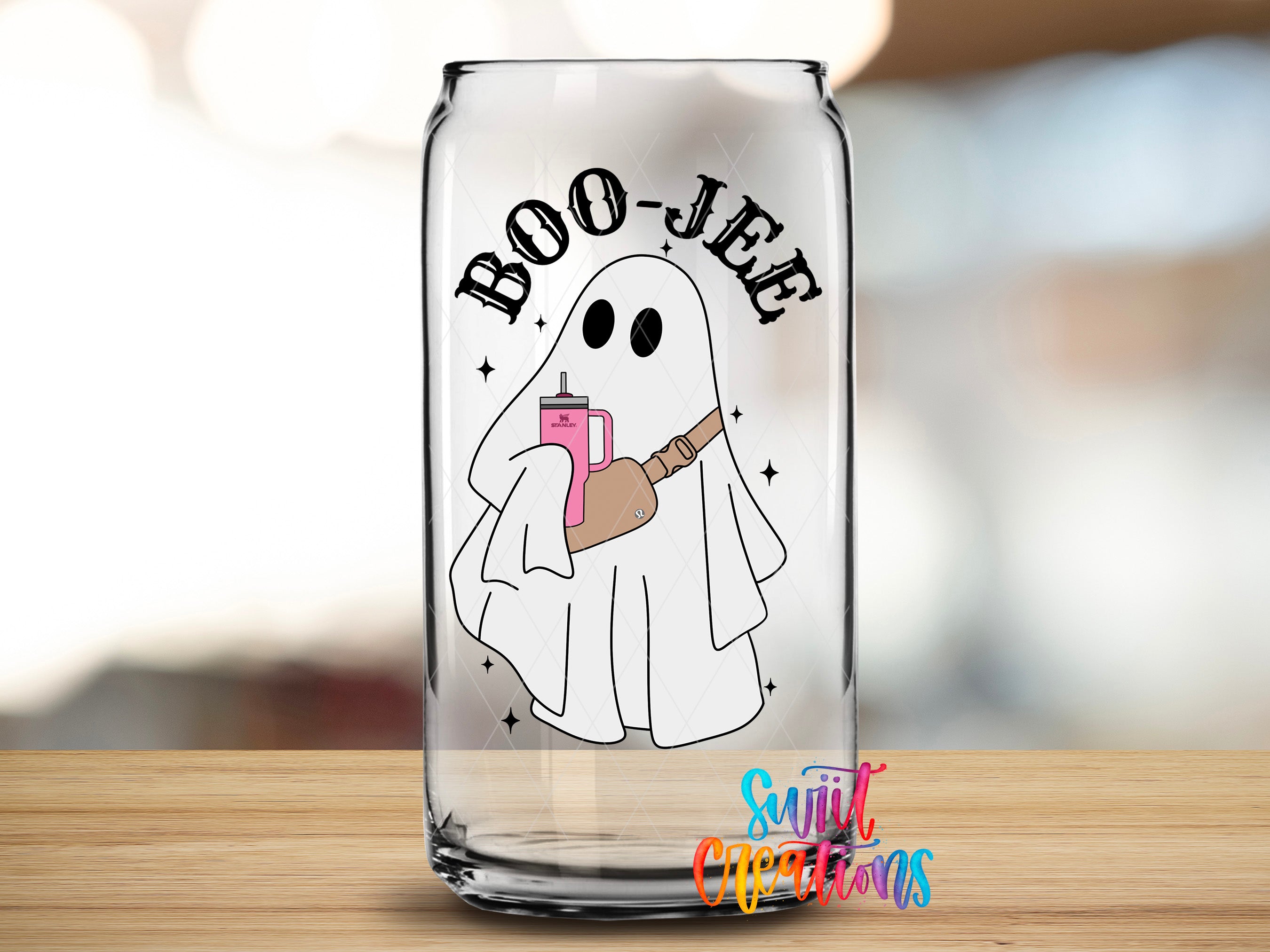 A glass can with a ghost illustration and the text "BOO-JEE" printed on it.