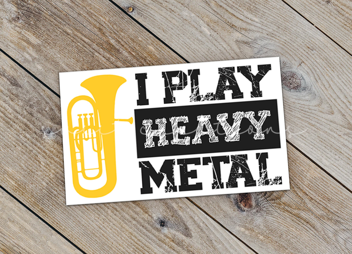 a sticker that says, i play heavy metal