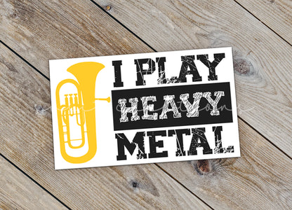 a sticker that says, i play heavy metal