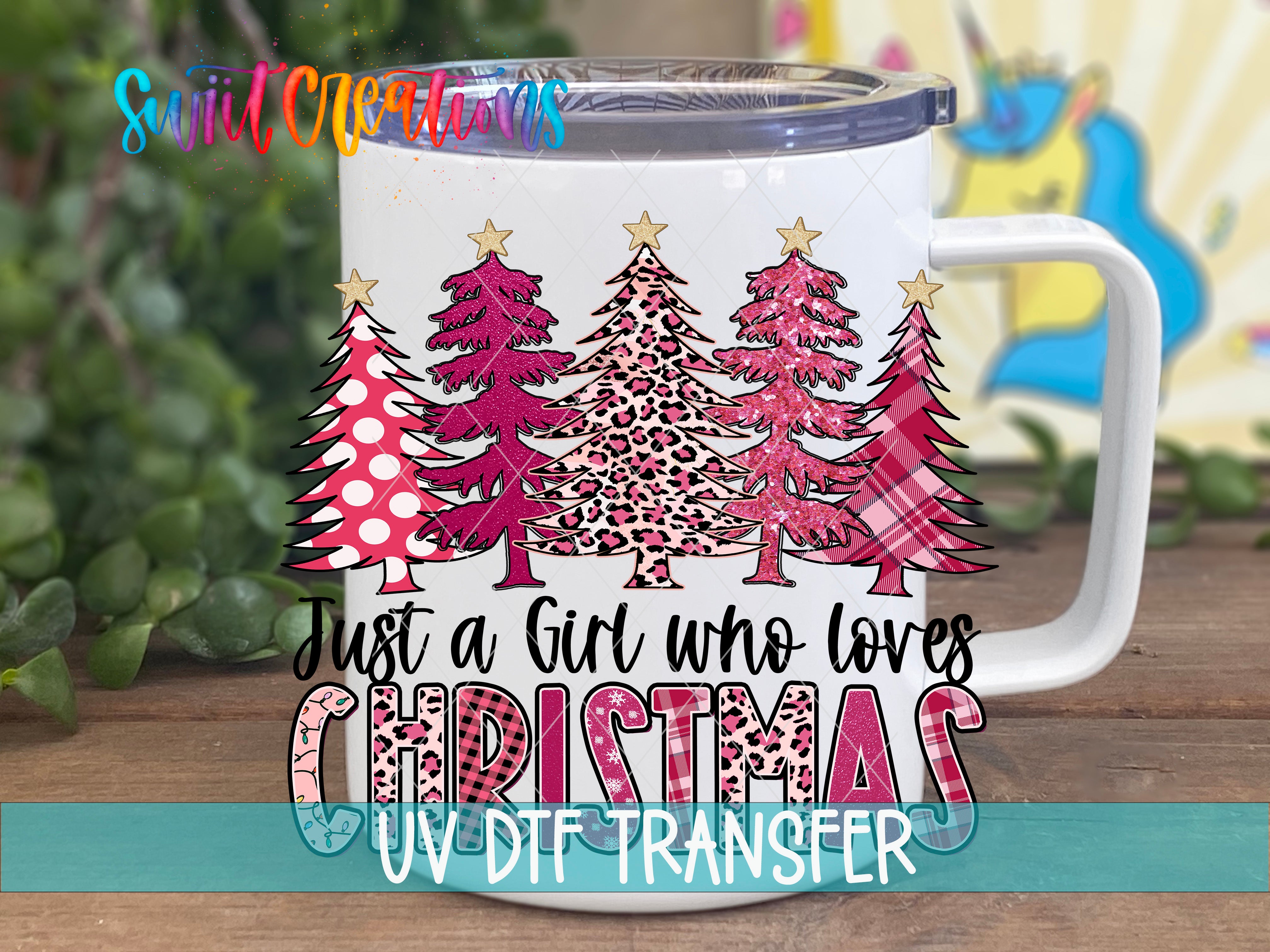 A white mug with a Christmas tree design and text printed on it.