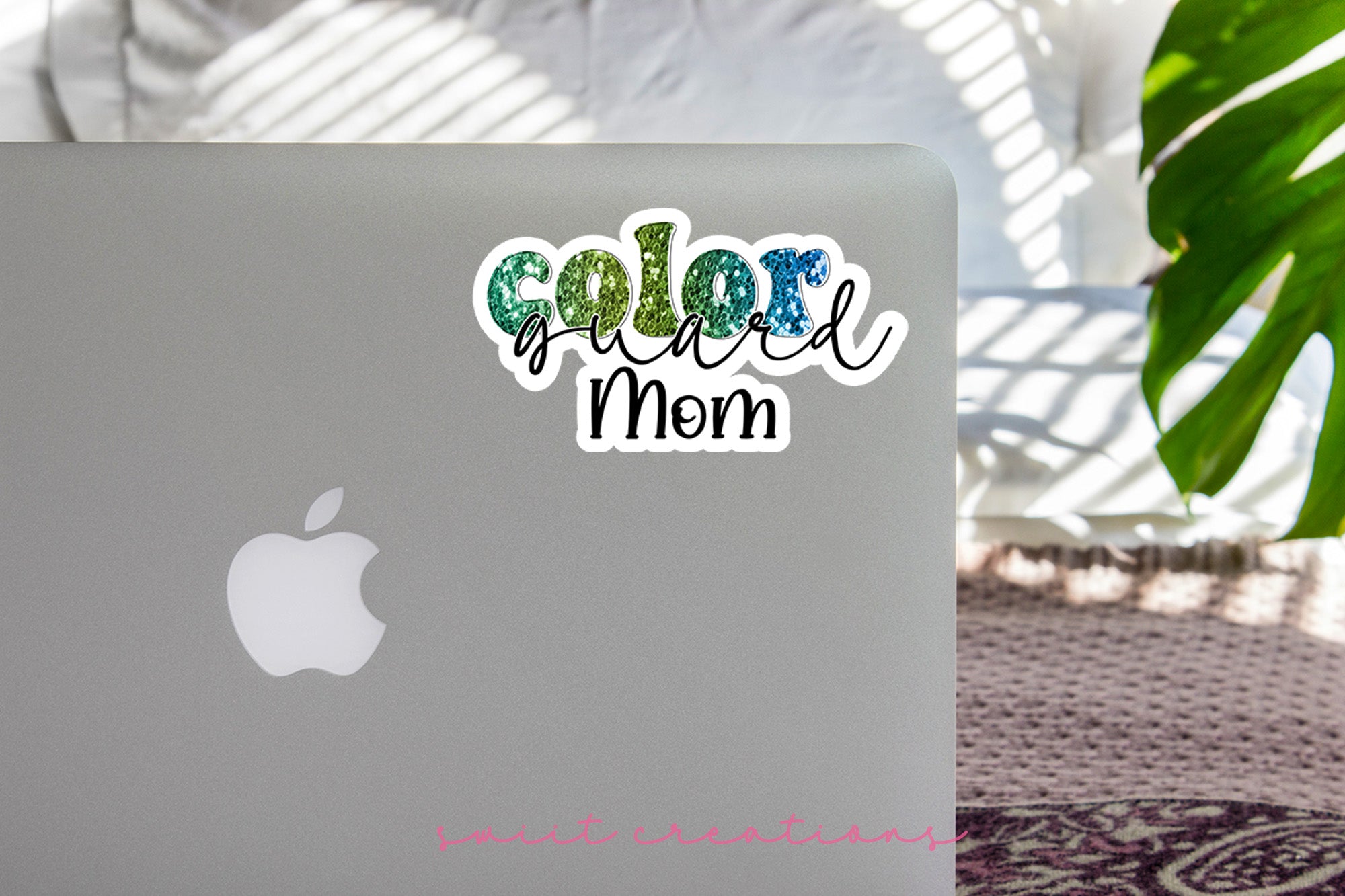 a laptop computer sitting on top of a table