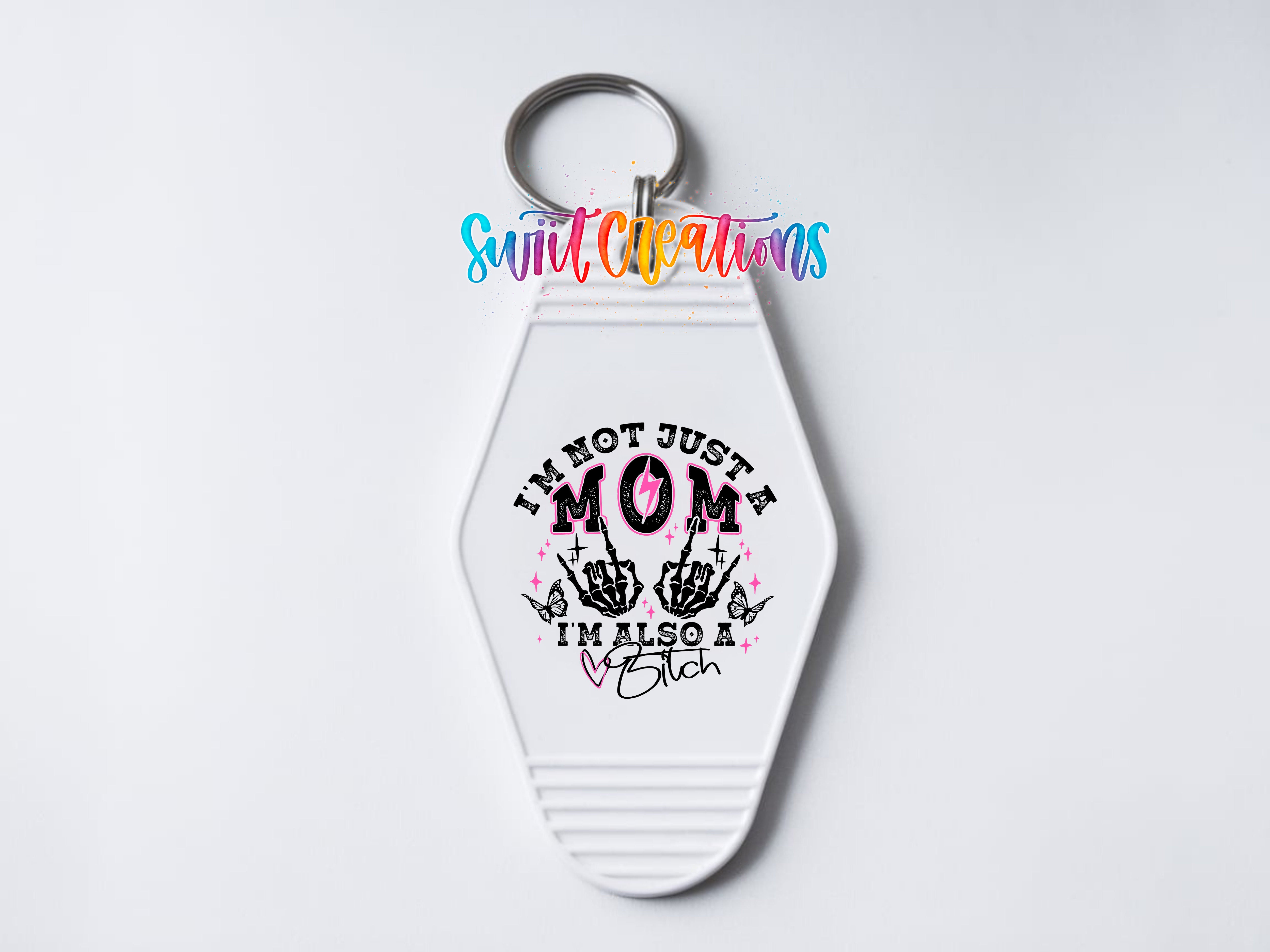 A keychain with a white hexagonal shape and a colorful design featuring text and graphics.