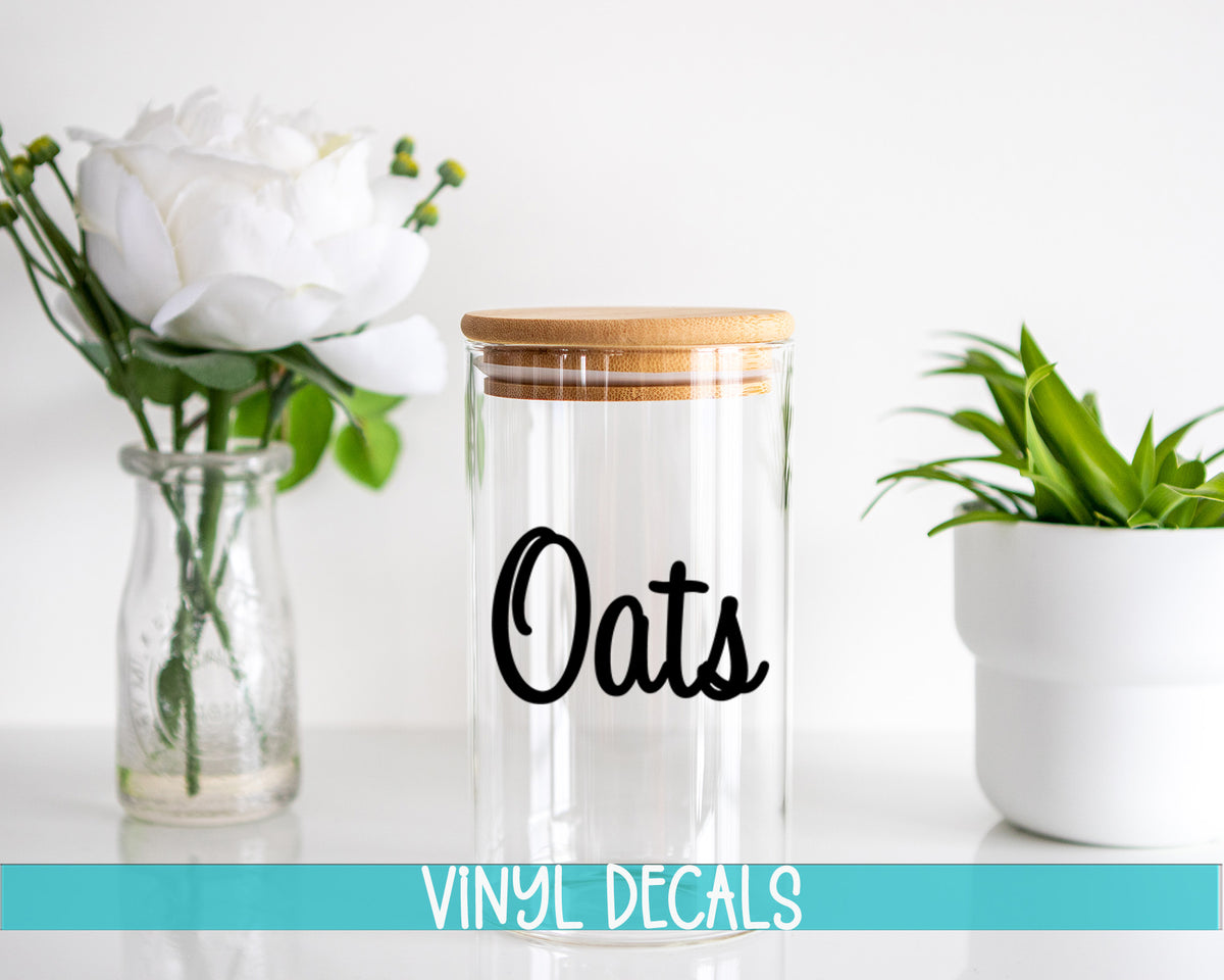 a glass jar with the word oats written on it next to a vase with