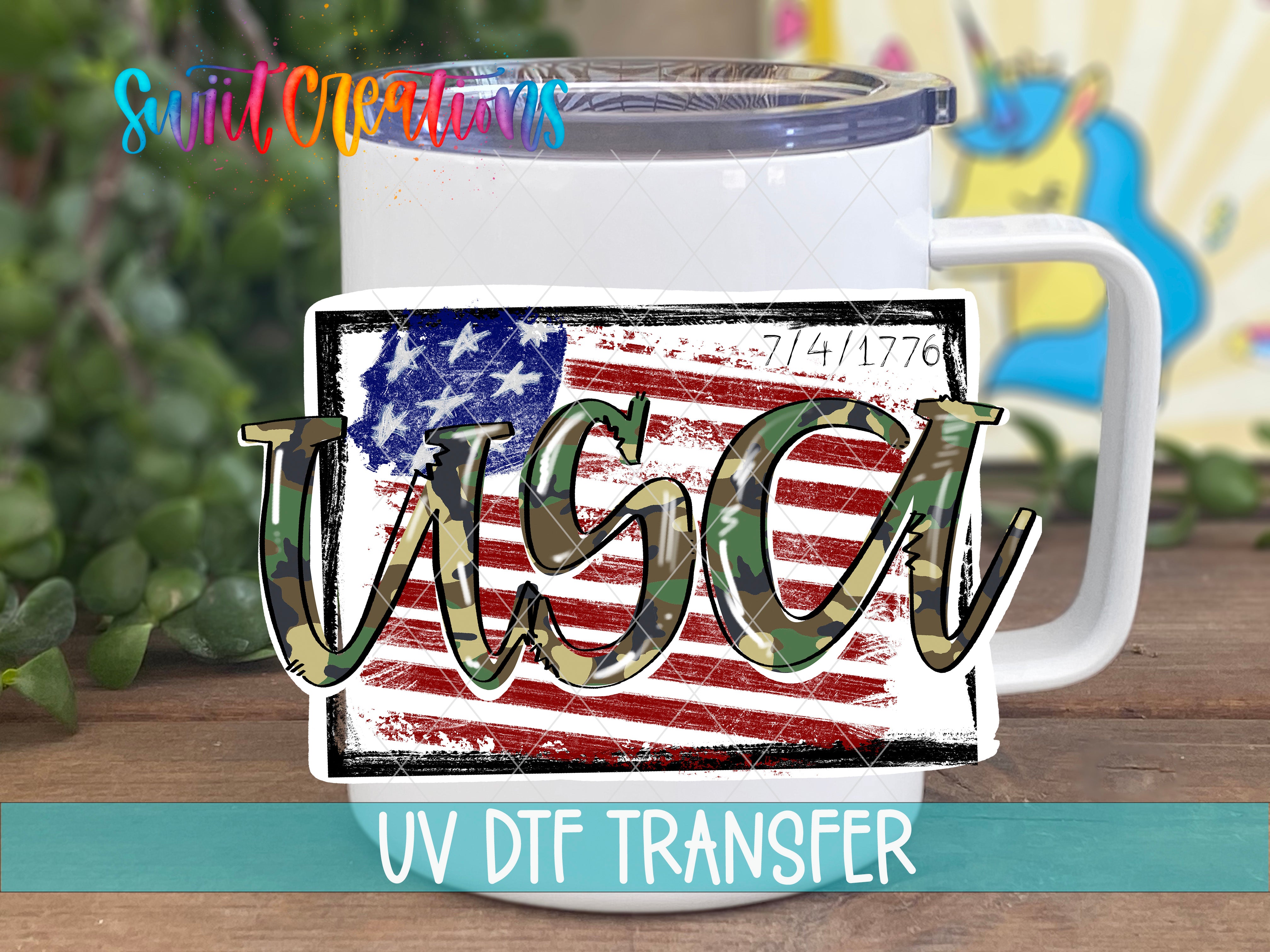 A white mug with a camouflage design featuring the word "USA" printed on it, placed on a wooden surface.