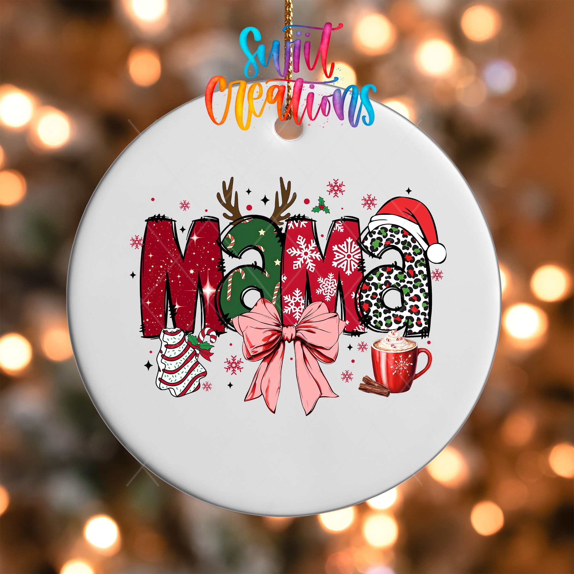 A white ceramic ornament with the word "Mama" written in colorful letters, surrounded by festive decorations such as snowflakes, a Santa hat, and a mug of hot chocolate.