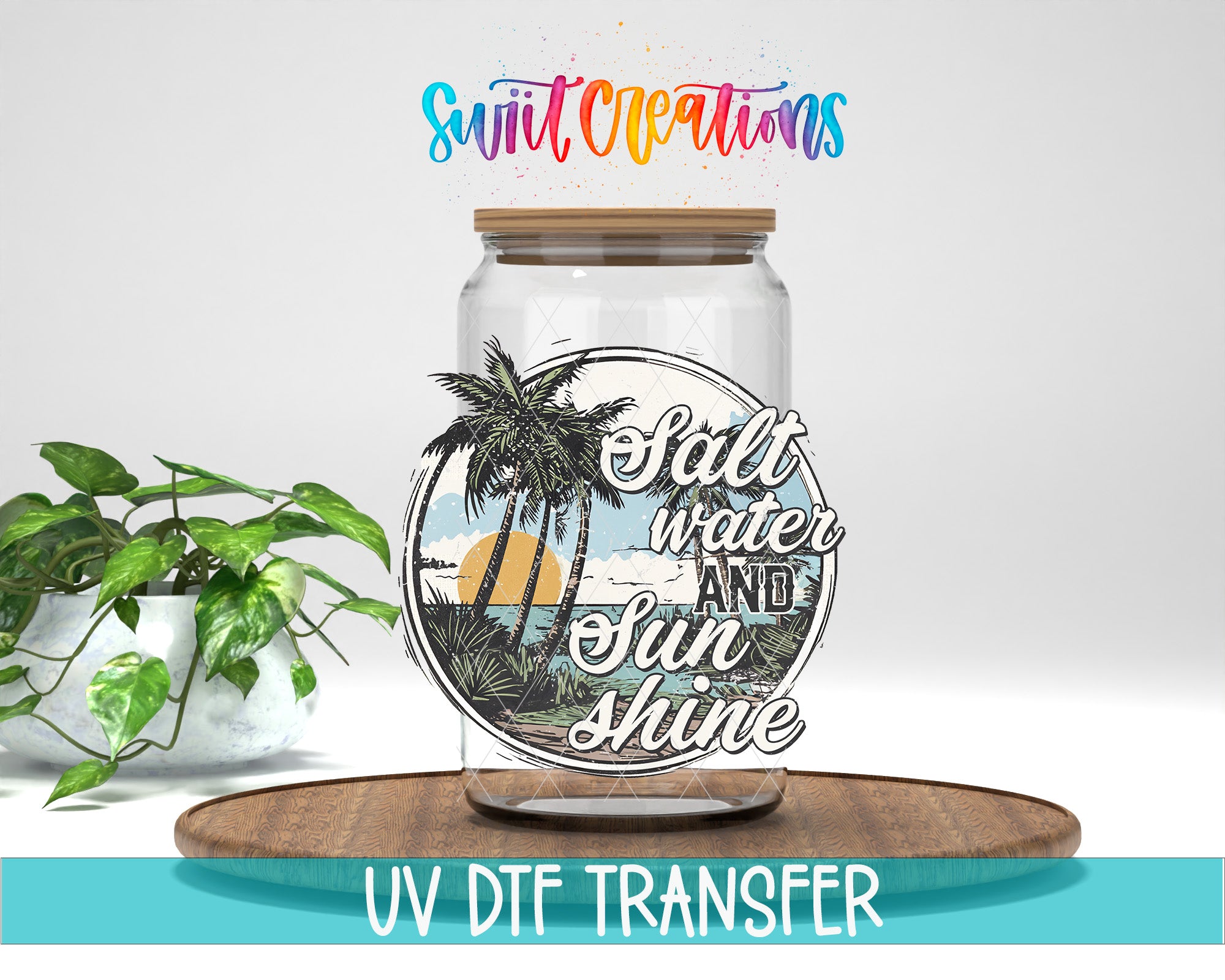 a glass jar with a tropical beach scene and the text "Salt water and sunshine" on it, placed on a wooden surface.