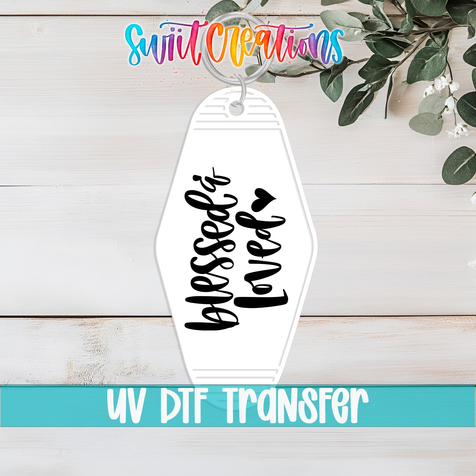A keychain with the text "Blessed is loved" printed on it, along with a colorful logo and the text "Swit Creations" above it.