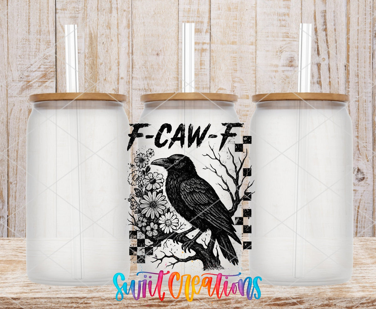 F-CAW-F Raven Gothic UV DTF transfer applied to a clear glass can set from Swiit Creations