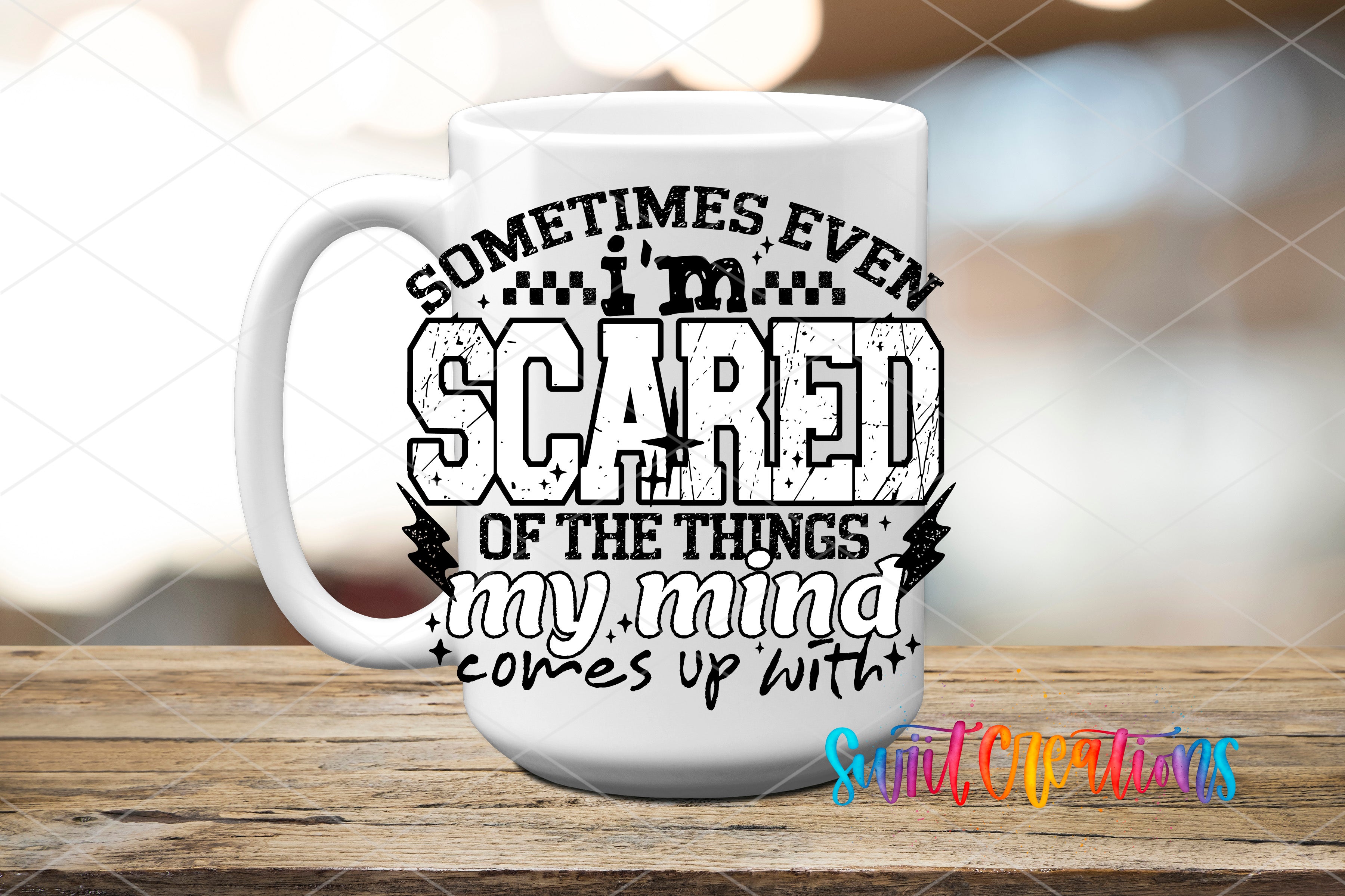A white mug with a black and white graphic design featuring the text "Sometimes even I'm scared of the things my mind comes up with" printed on it.