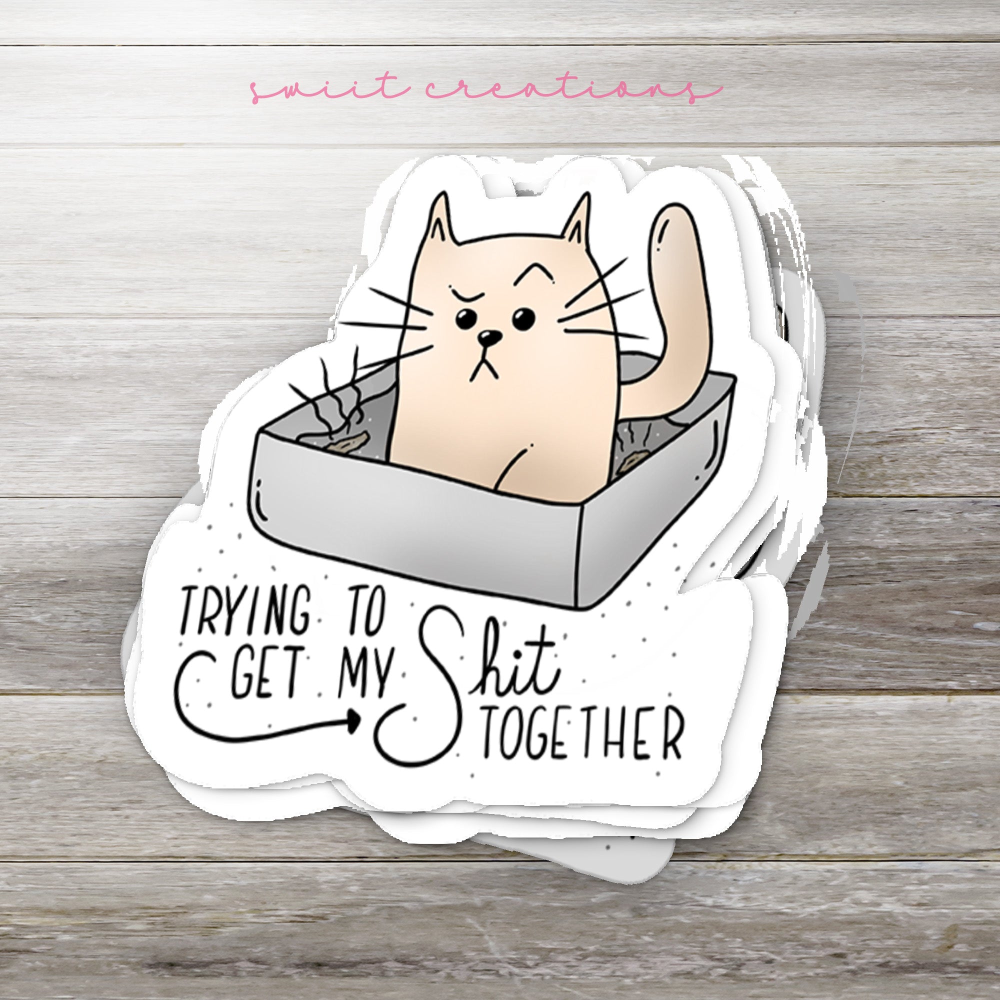 a sticker with a cat inside of a box