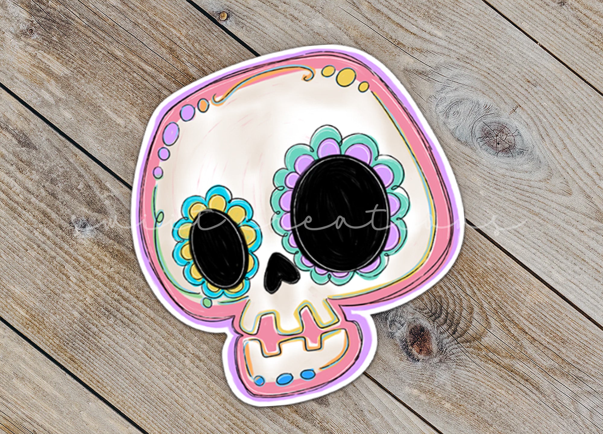 a paper plate with a skull painted on it