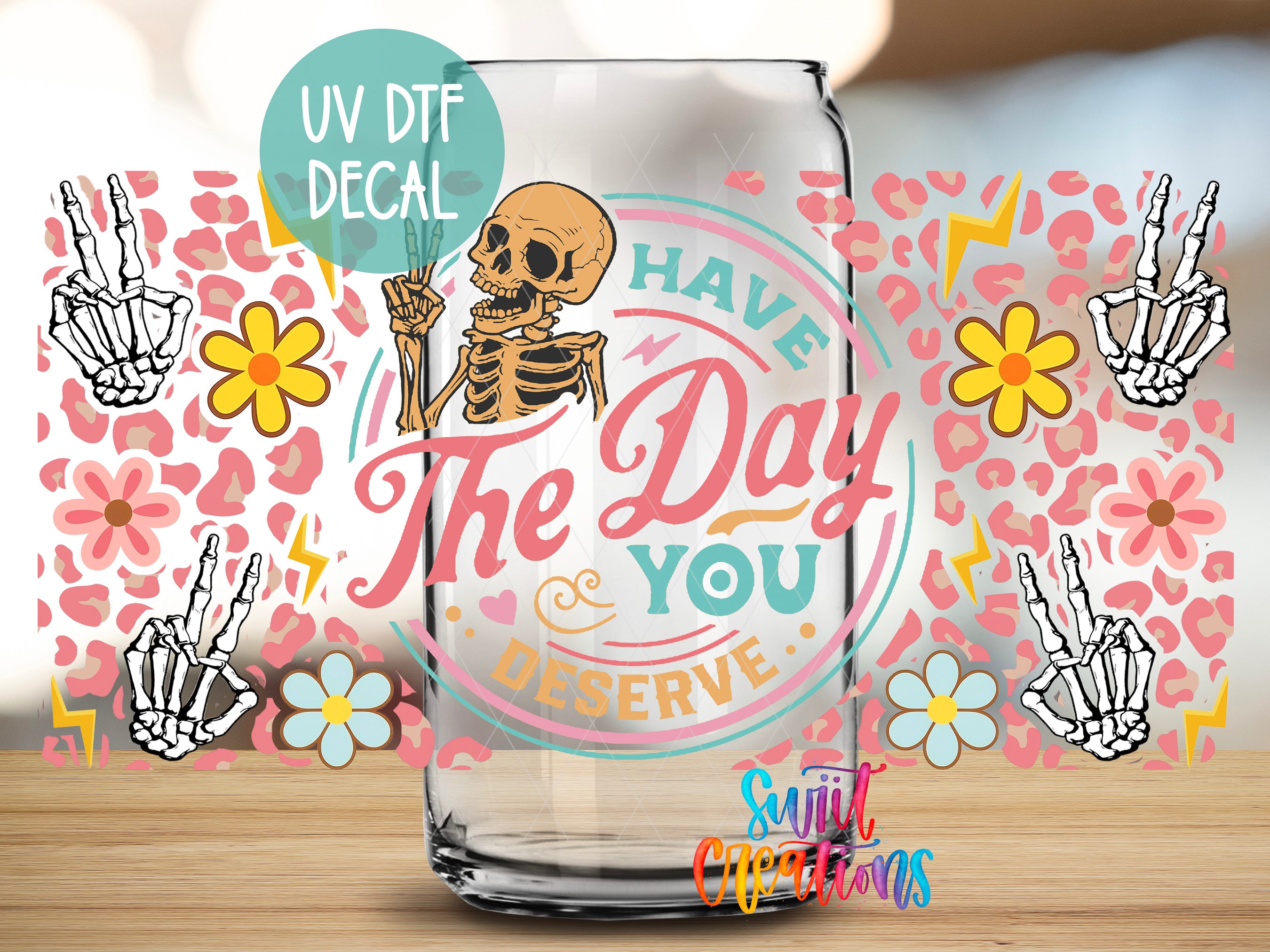 a glass mug with a skeleton holding a peace sign, surrounded by various colorful and whimsical elements such as flowers, lightning bolts, and other abstract designs.