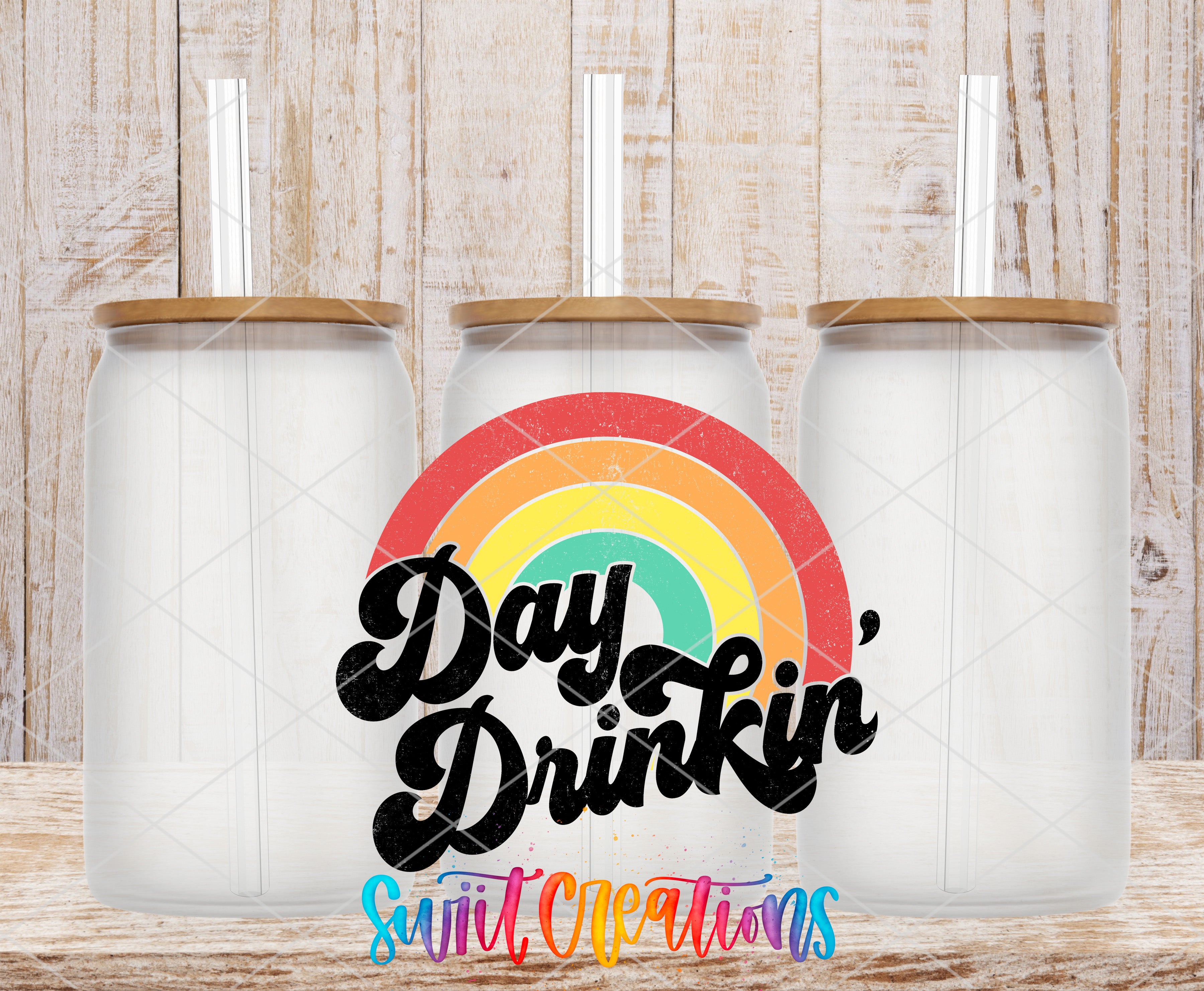 three clear glass jars with wooden lids, arranged in a row against a wooden background. The jars have straws attached to their lids. In the center of the image, there is a colorful rainbow graphic, and the text "Day Drinking" is written in a stylized font.