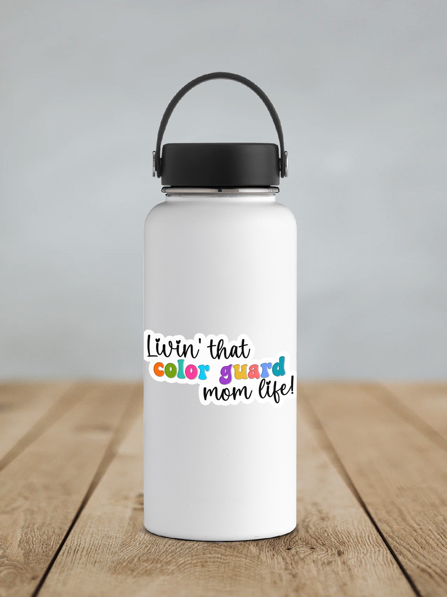 a white water bottle with a black lid