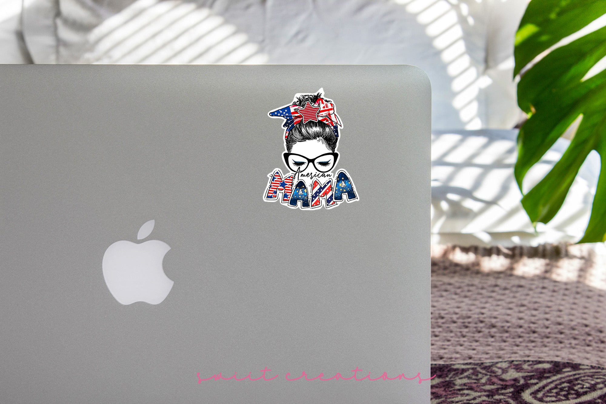 a laptop with a sticker of a woman wearing a bandana