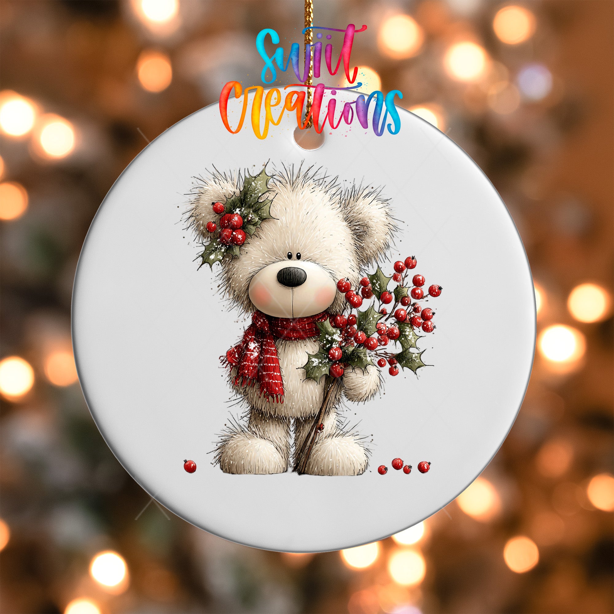 A white teddy bear ornament with a red scarf and berries, hanging against a blurred background with colorful lights.