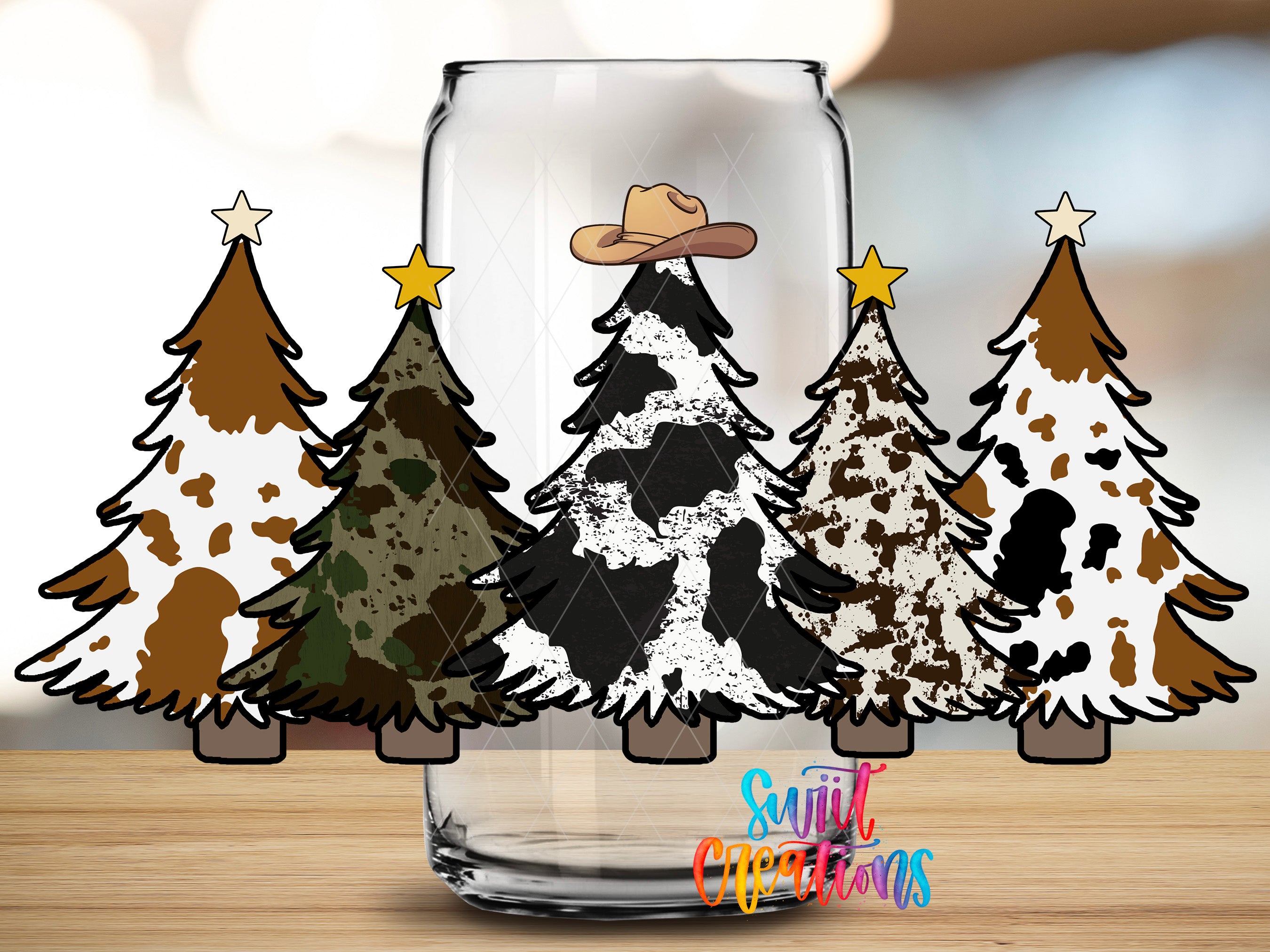 A collection of stylized Christmas trees in various colors and patterns, with a cowboy hat on one of them, is displayed in a glass jar.