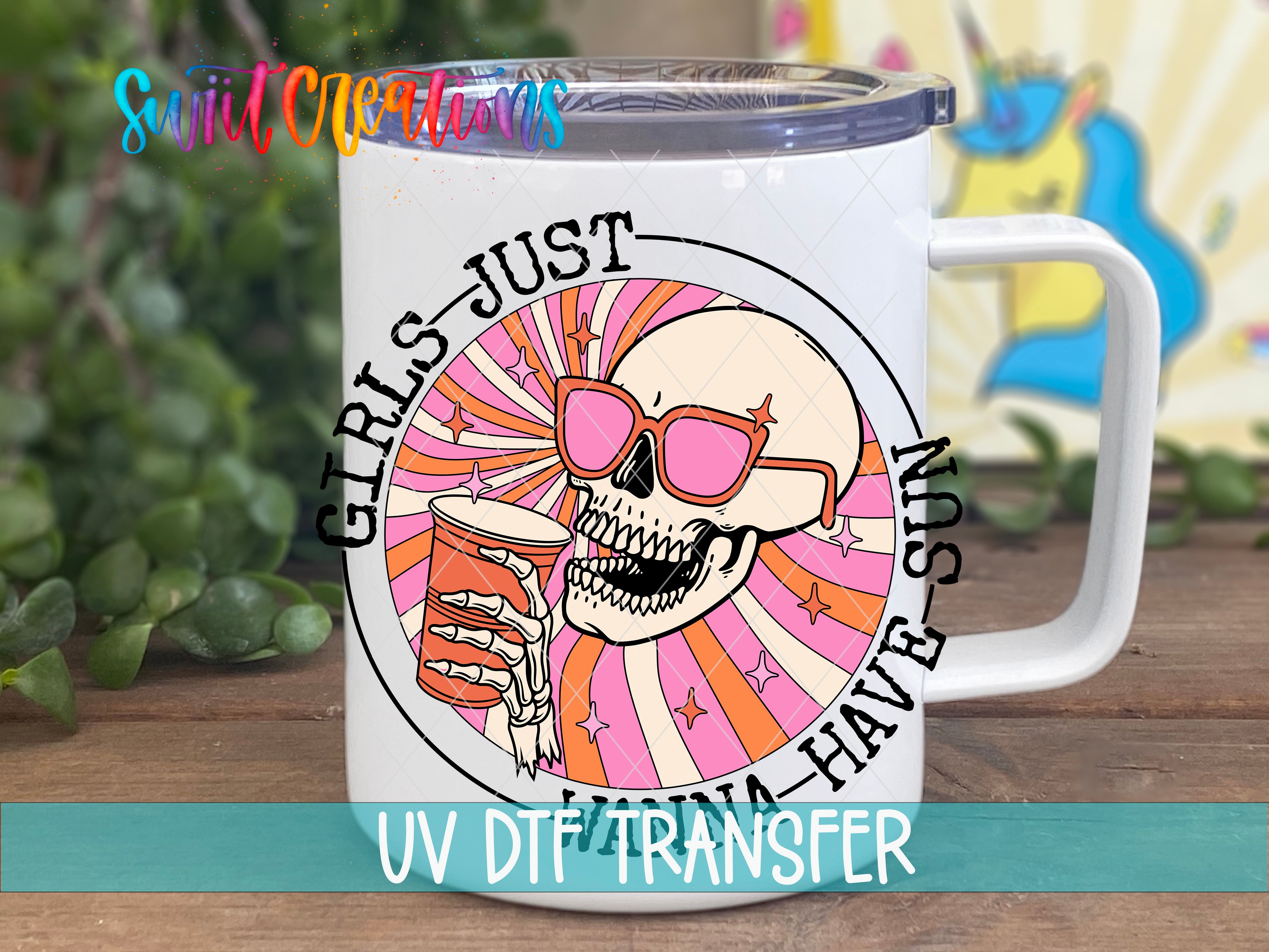 A white mug with a colorful design featuring a skull wearing sunglasses and holding a drink, along with the text "GIRLS JUST HAVE HAVEN'S" and "UV DTF TRANSFER".