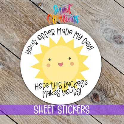 a sticker with a sun on it on a wooden surface