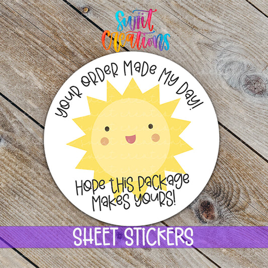 a sticker with a sun on it on a wooden surface