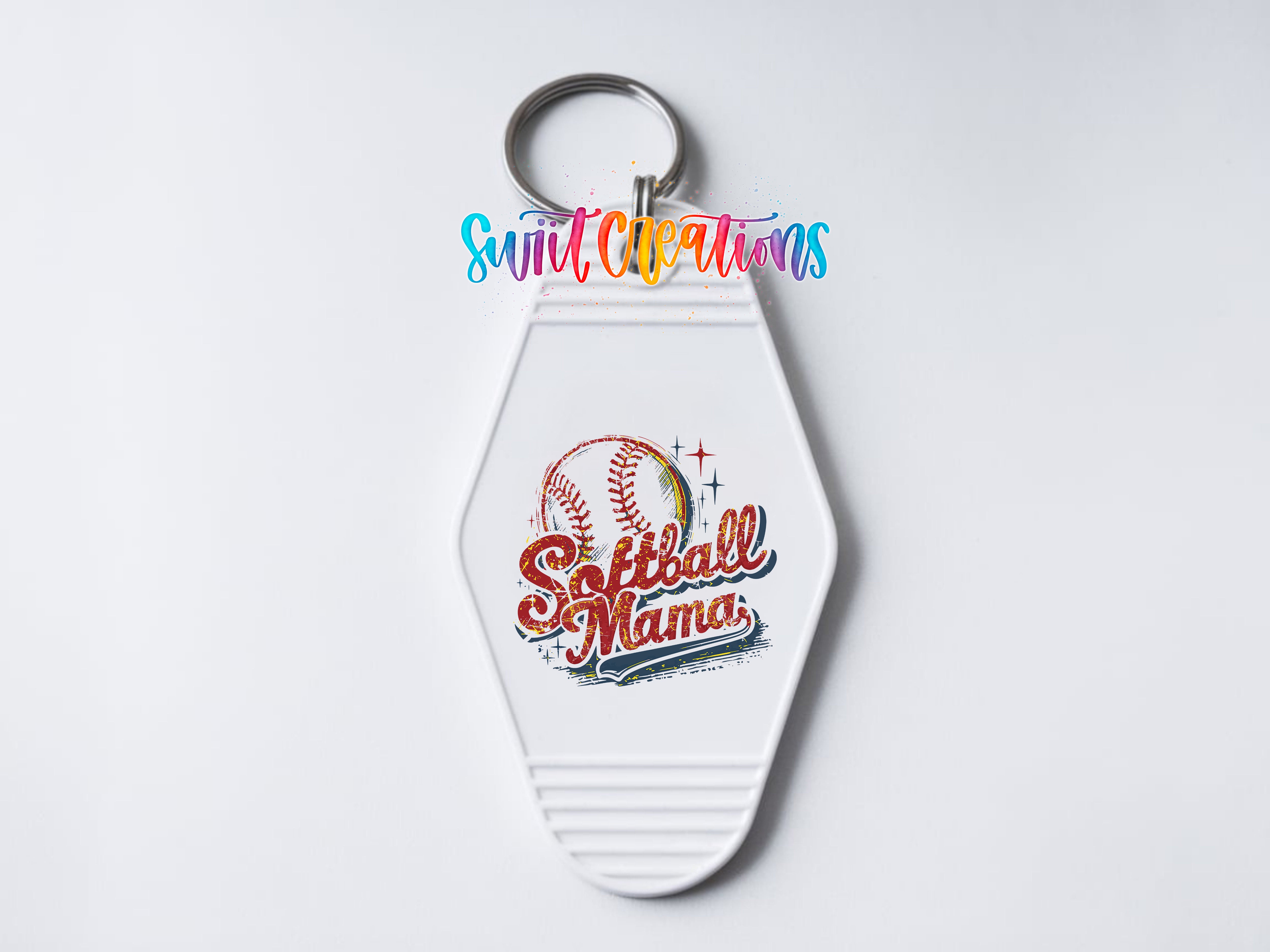 A keychain with a baseball design and the text "Softball Mama" printed on it.