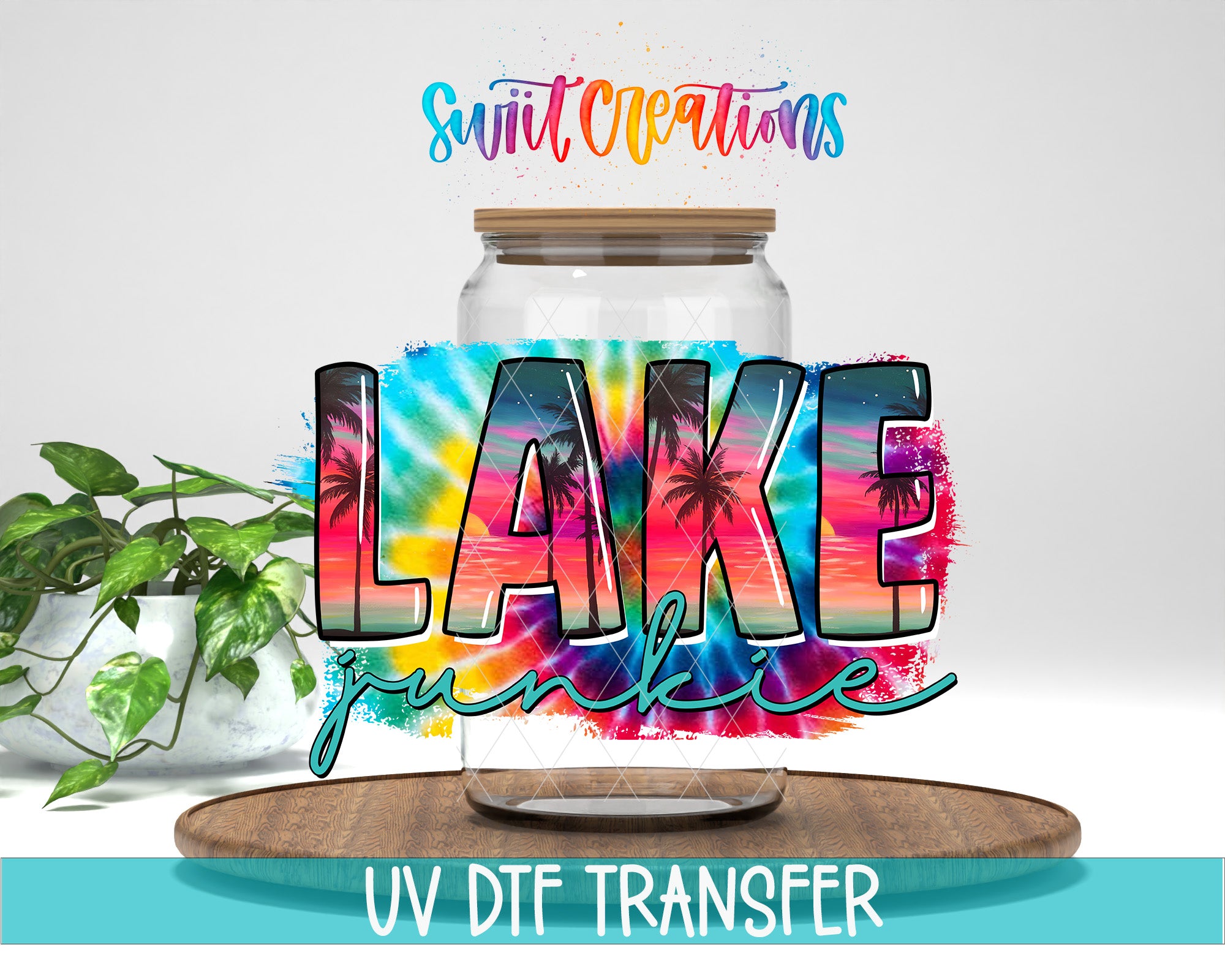 a large jar with a tie-dye design, surrounded by a plant and a wooden tray.