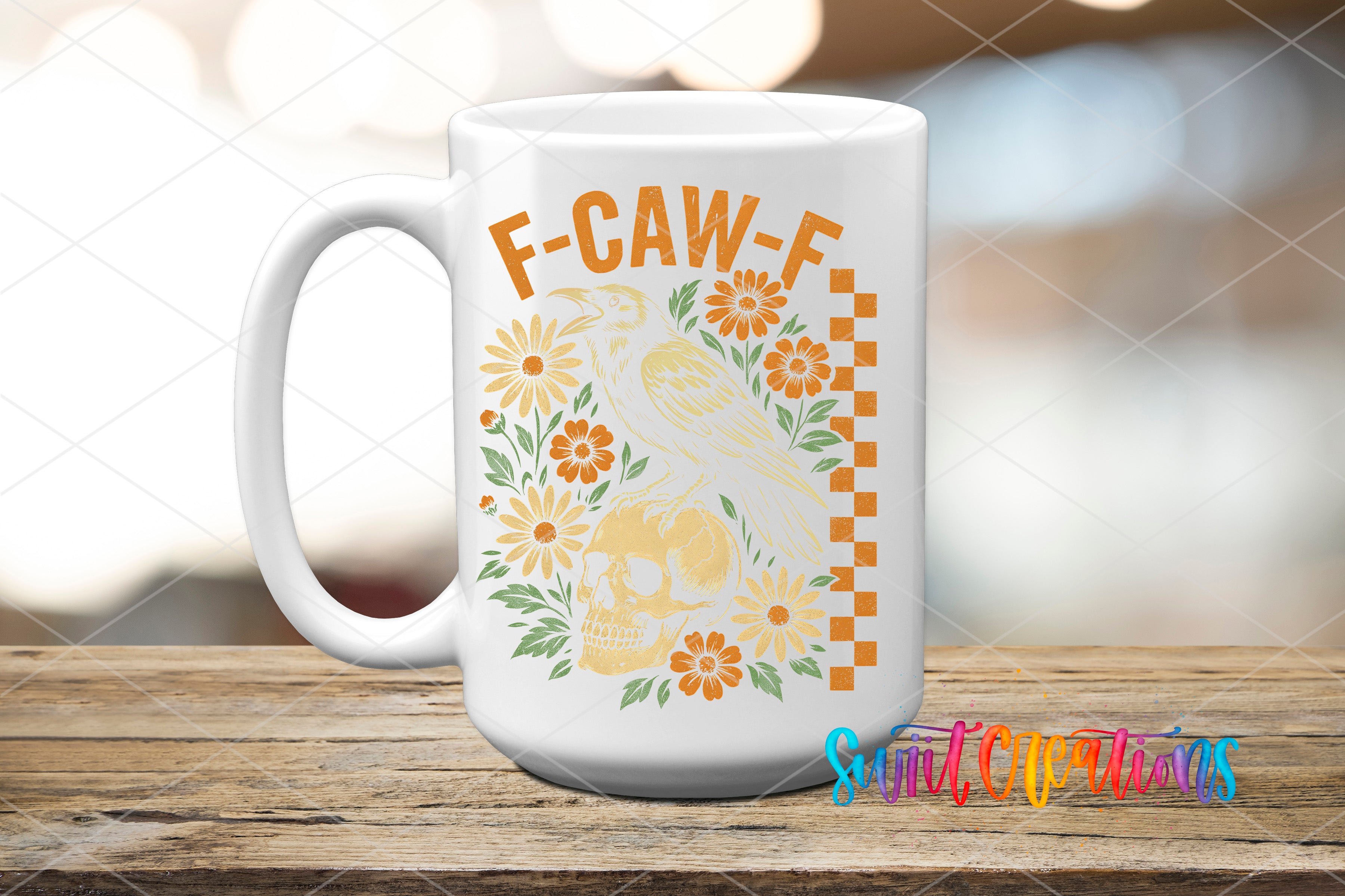 A white ceramic mug with a floral design and the text "F-CAW-F" printed on it, placed on a wooden surface.